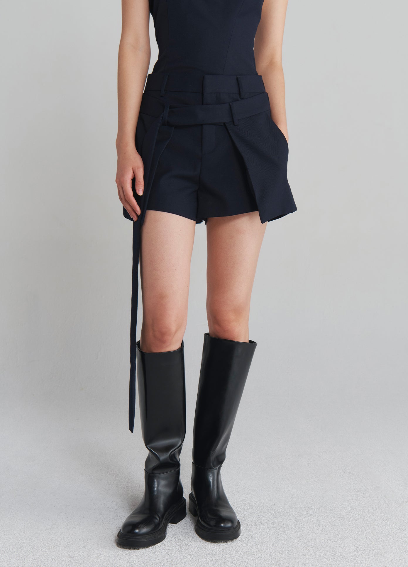 MONSE Deconstructed Wrap Tailored Shorts in Navy on model front bottom view