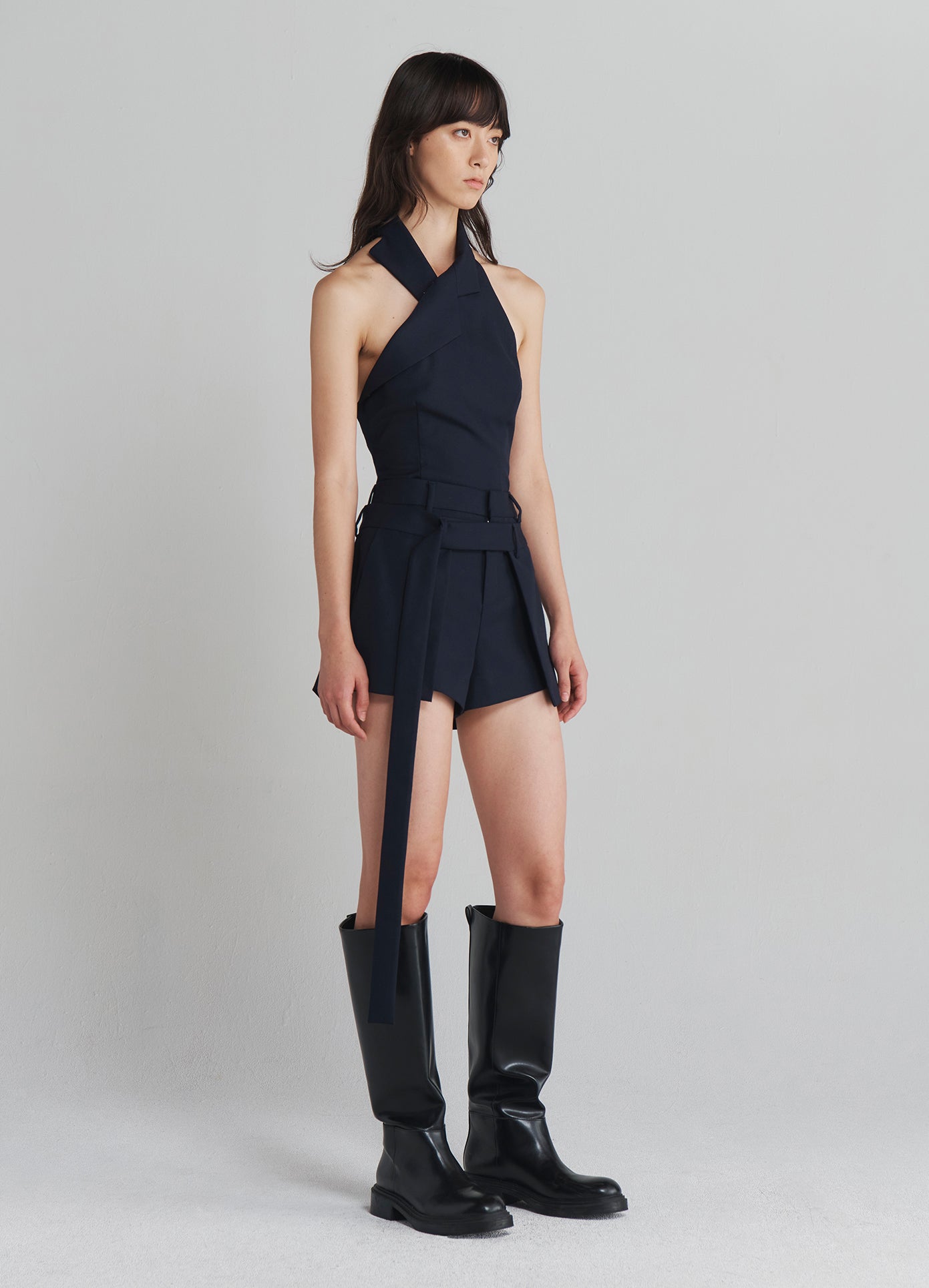 MONSE Deconstructed Wrap Tailored Shorts in Navy on model full side view