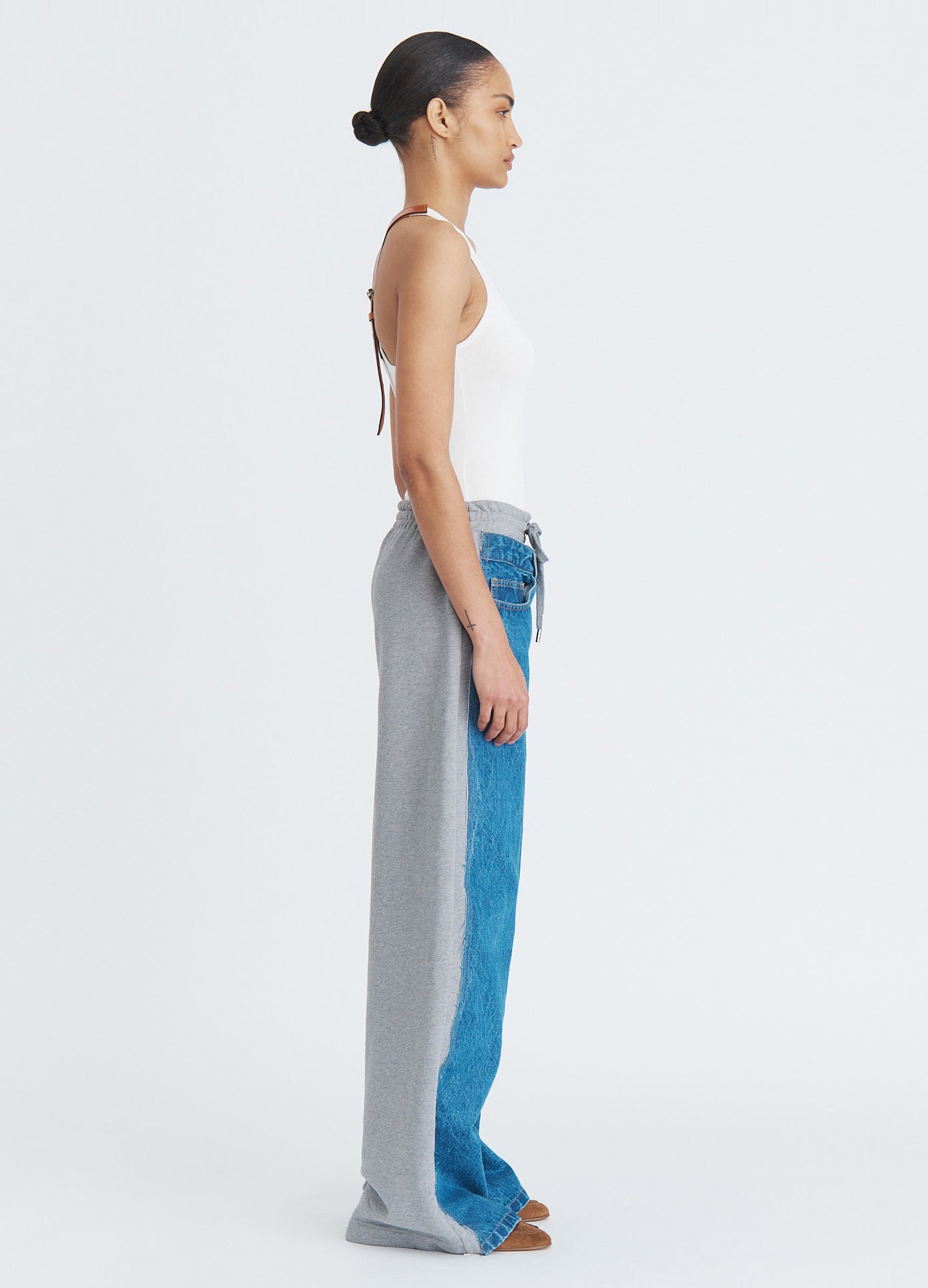 MONSE Denim Combo Sweatpants in indigo on model full side view