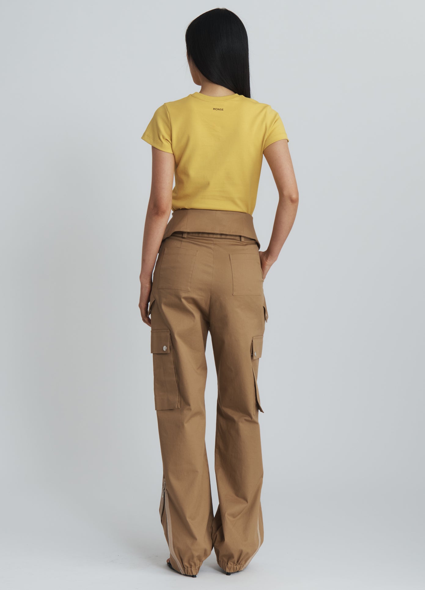 MONSE Double Waistband Cargo Pants in beige on model full back view