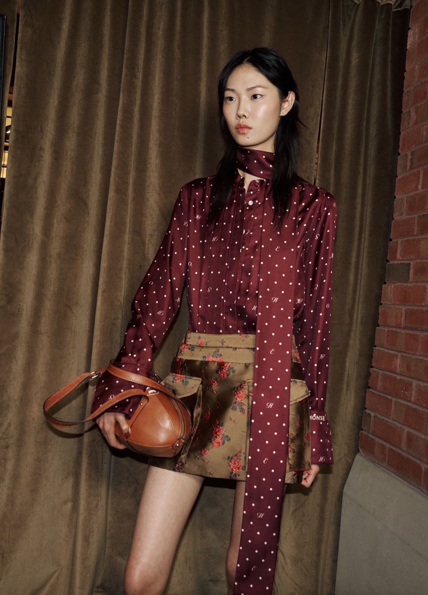 MONSE Double Waistband Cargo Skirt in brown on runway model backstage posing