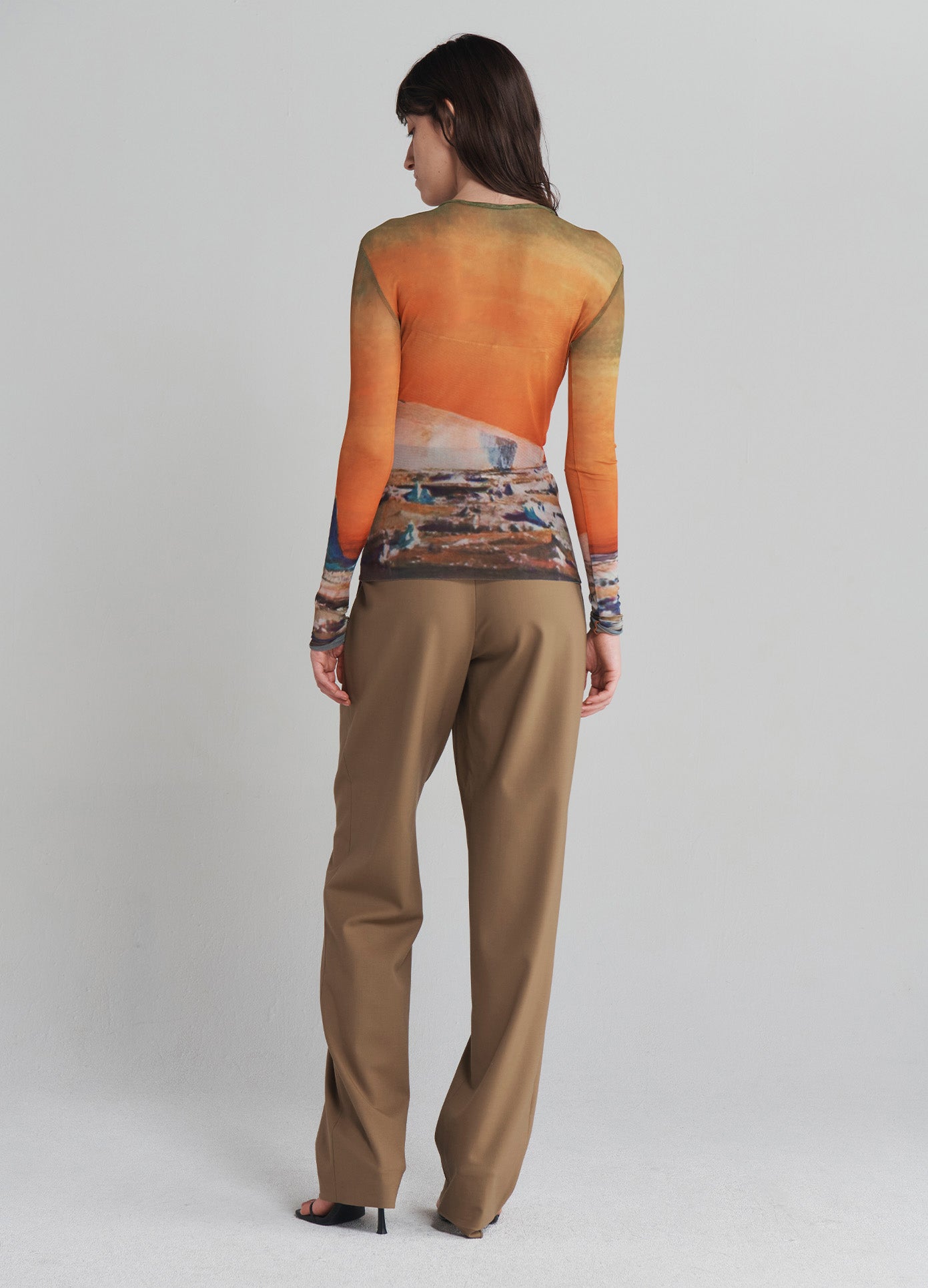 MONSE Double Waistband Trousers in Dark Khaki on model with shirt un-tucked full back view