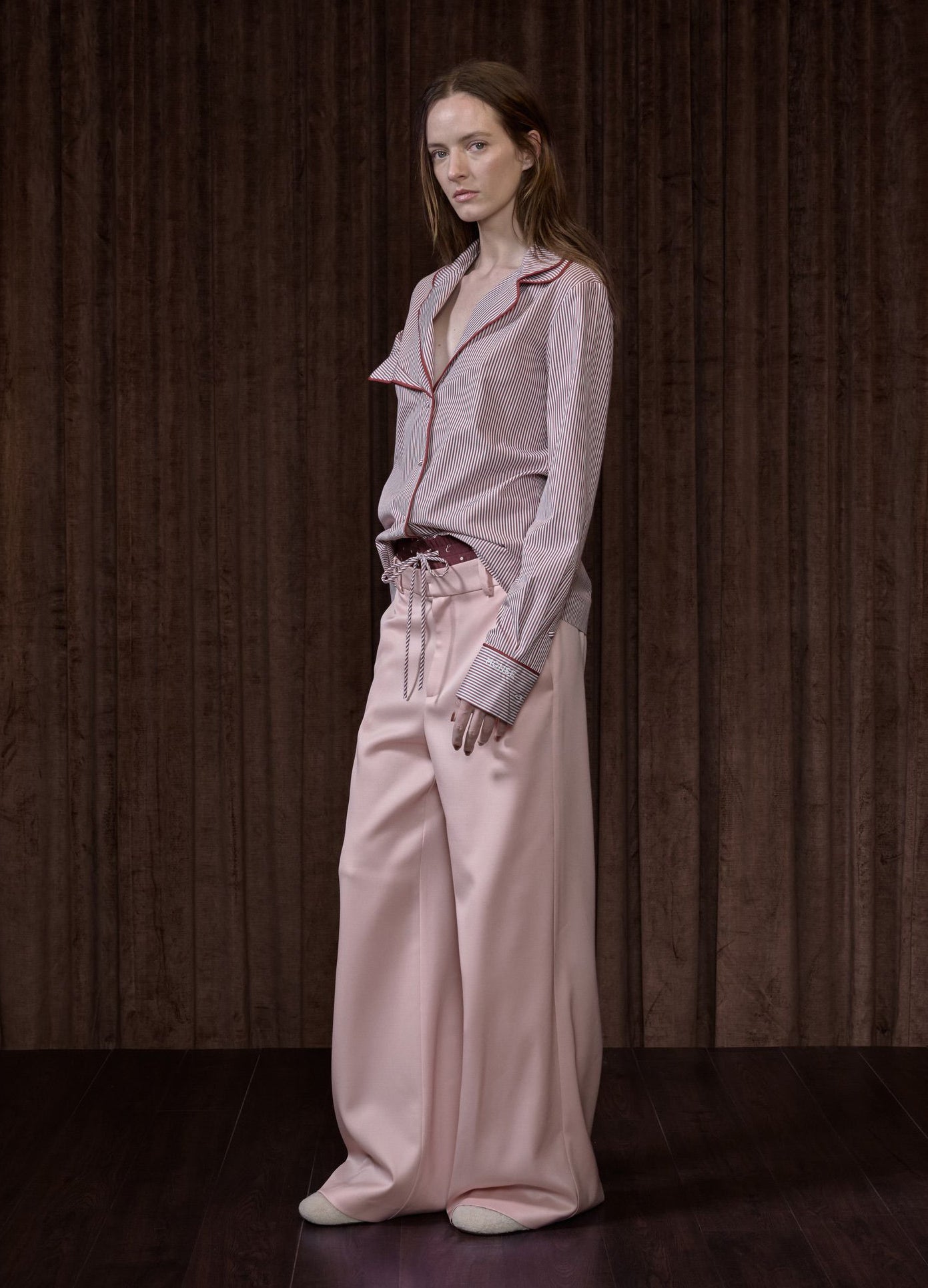 MONSE Double Waistband Trousers in pink on runway model full side view