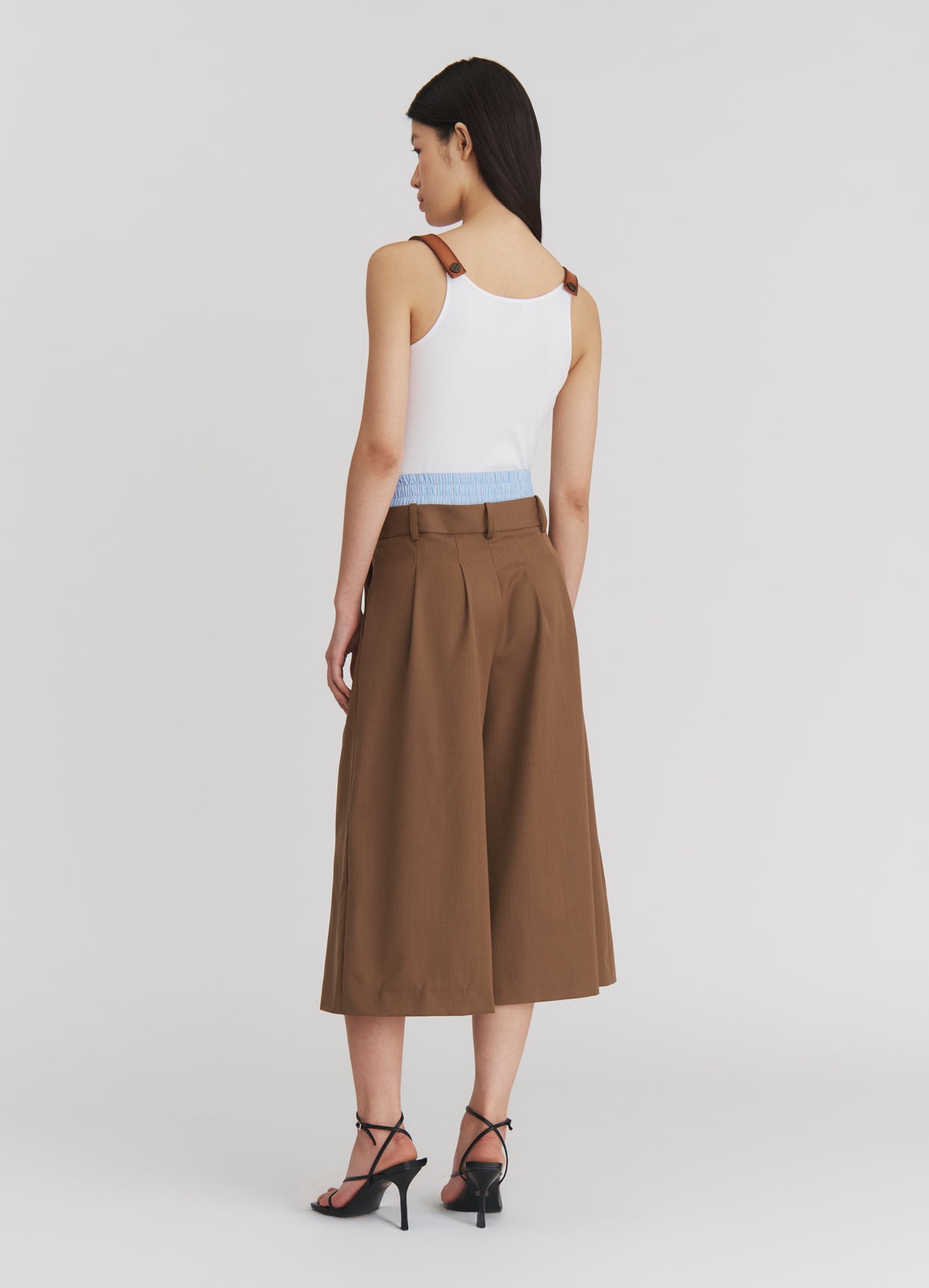 MONSE Double Waistband Wide Leg Shorts in Beige on model full back view