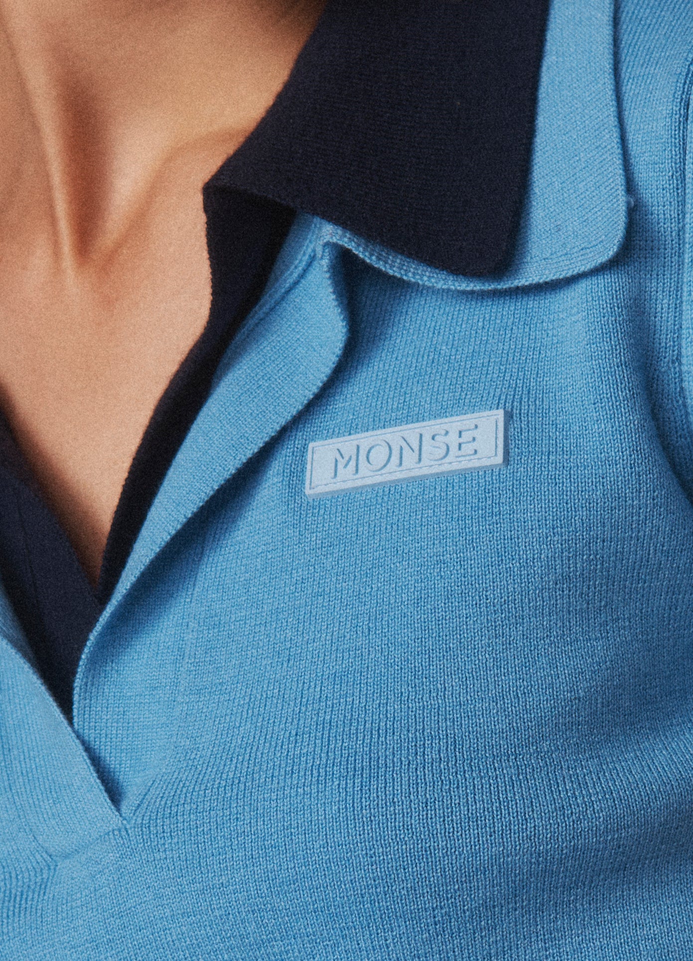 MONSE Double Half Front Placket Knit Tee in sky blue and dark sapphire on model MONSE tag image