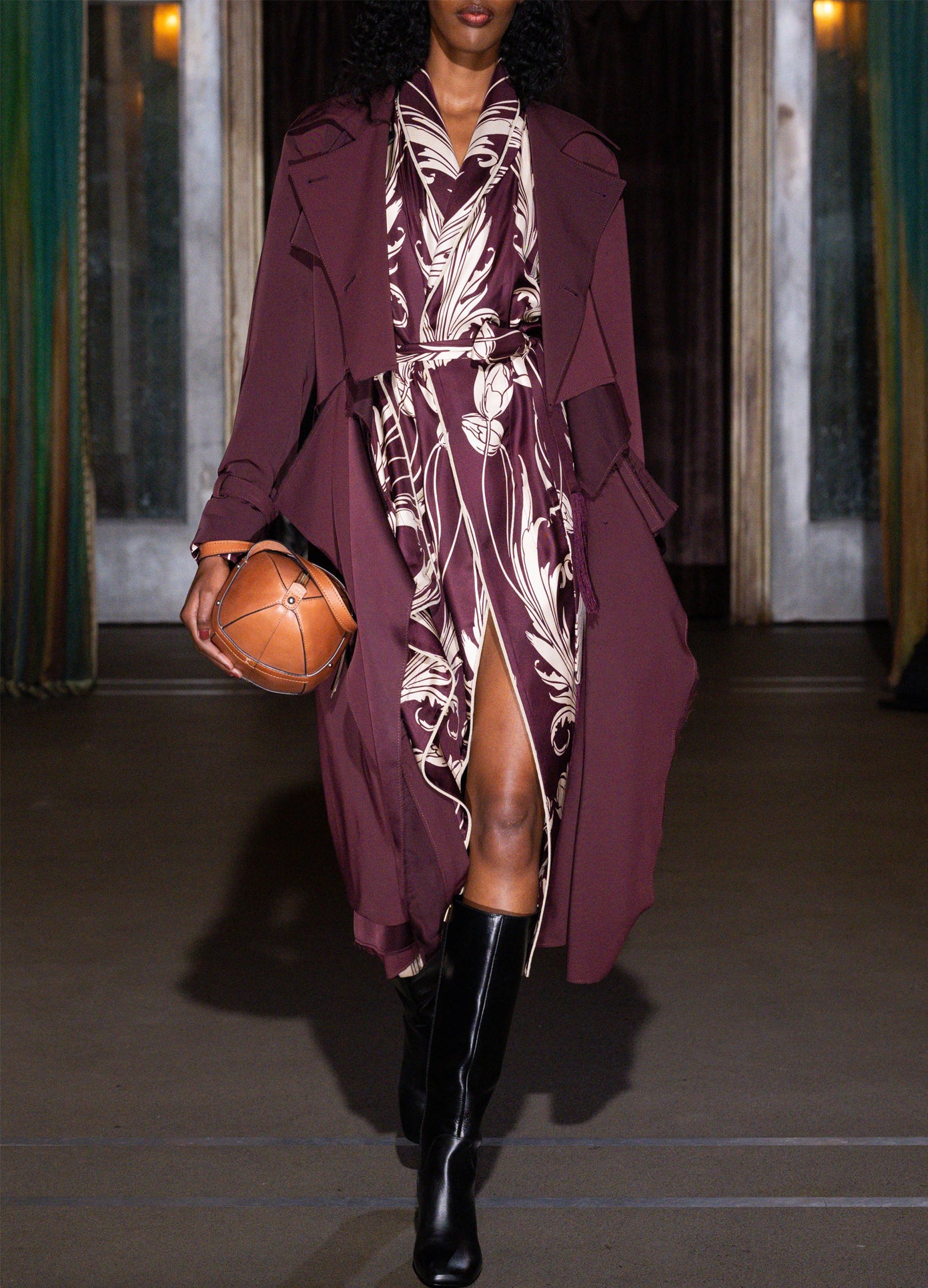 MONSE Draped Scarf Top in burgundy on model walking runway