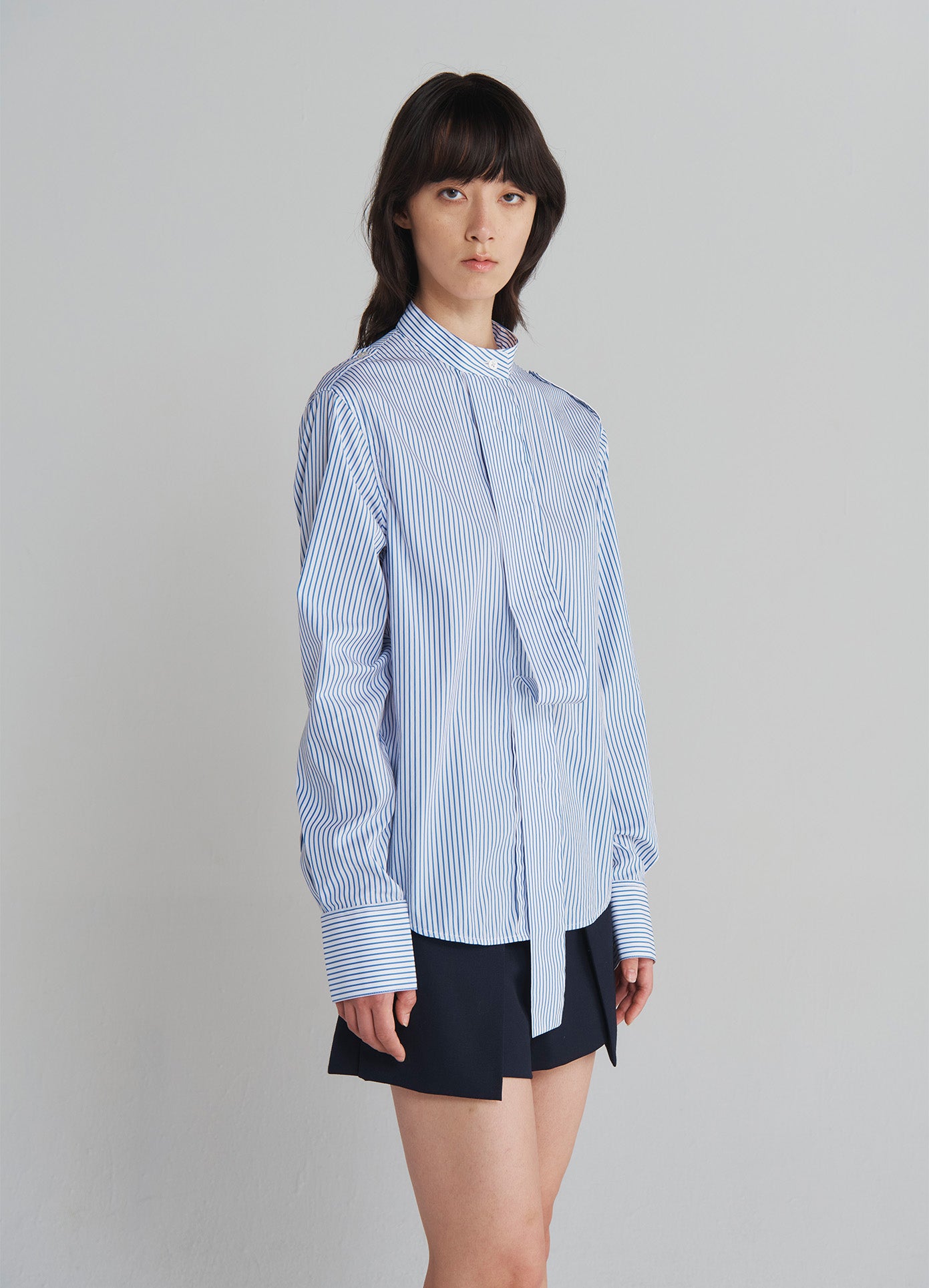 MONSE Epaulette Buttoned Shirt in Ivory and Navy on model side view