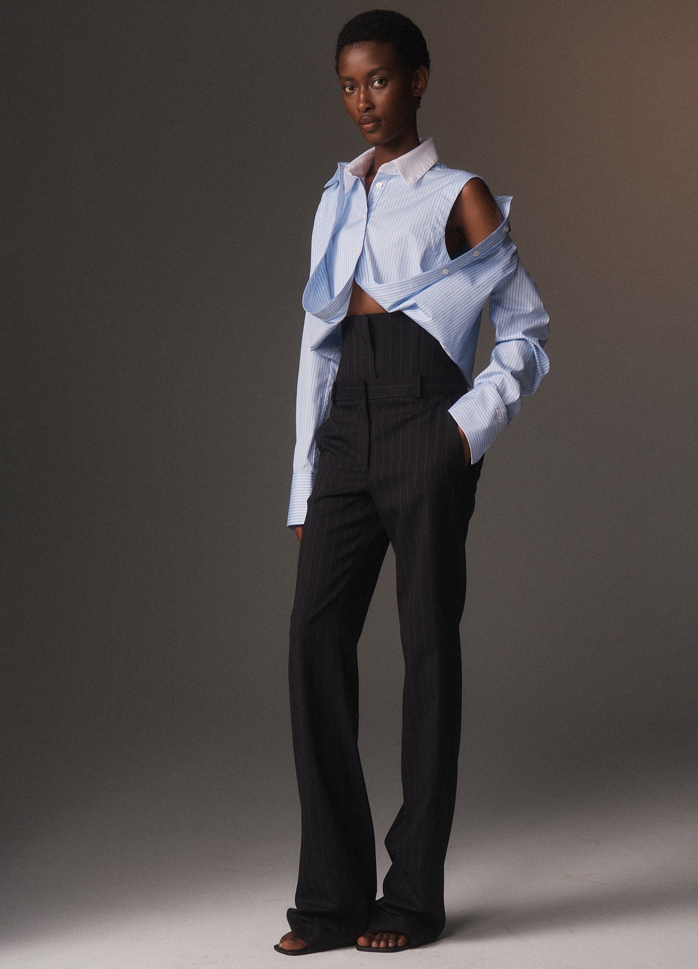 MONSE Fold Up Cropped Button Down Shirt in sky blue and white on model lookbook image