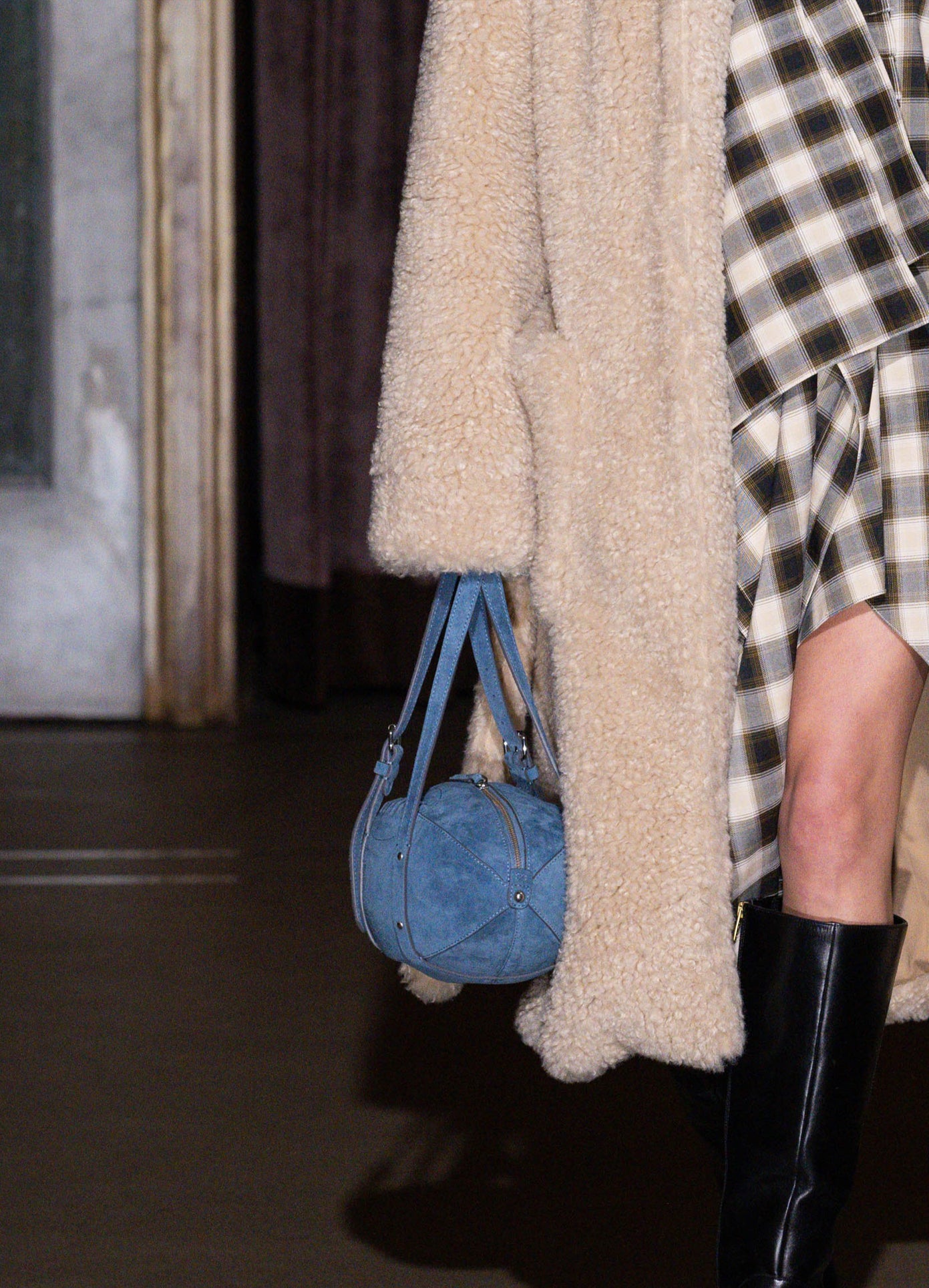 MONSE Football Bag Purse in blue carried on stage during the runway show