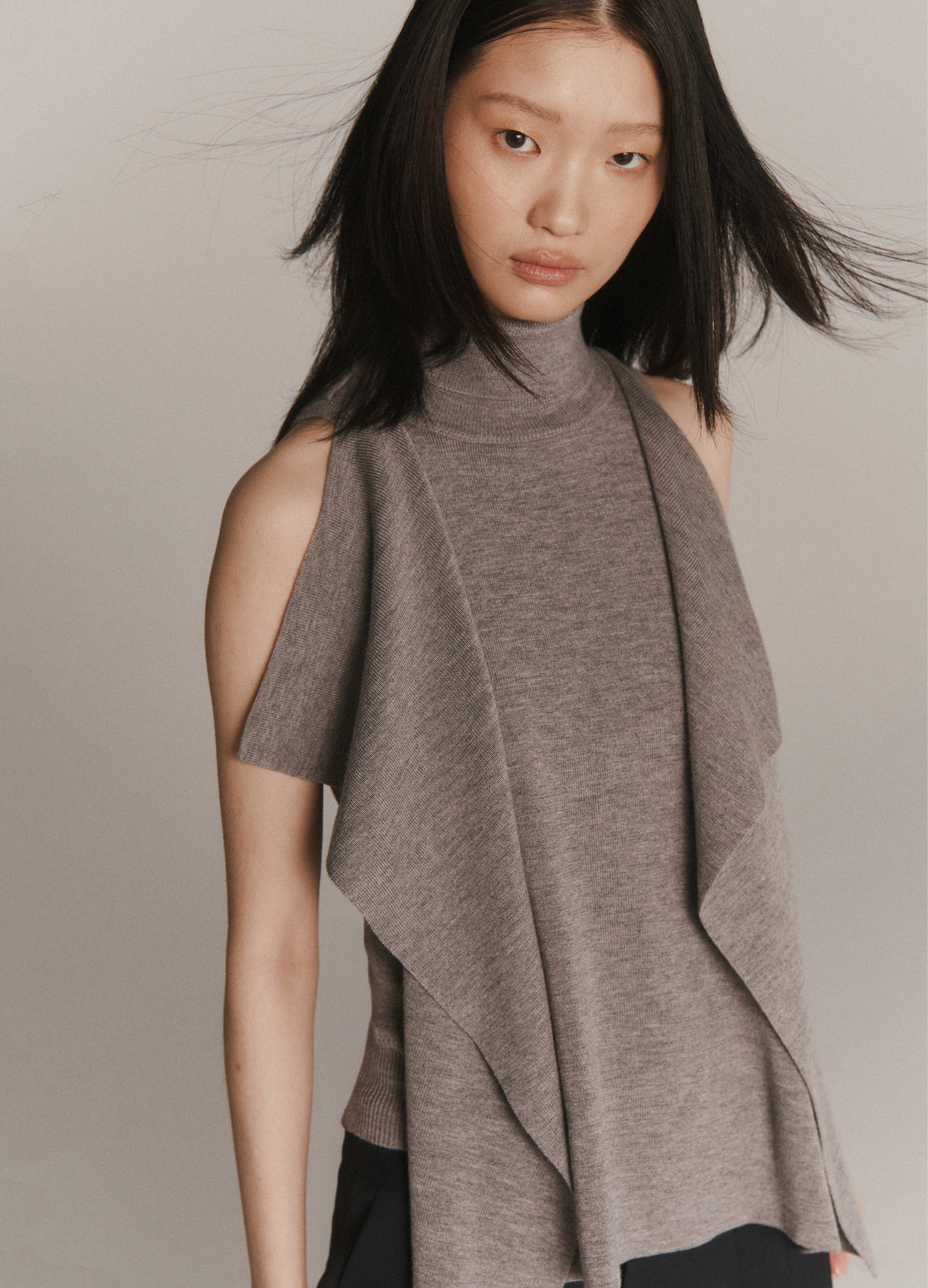 MONSE Front Cascade Turtleneck Knit Top in grey on model lookbook image