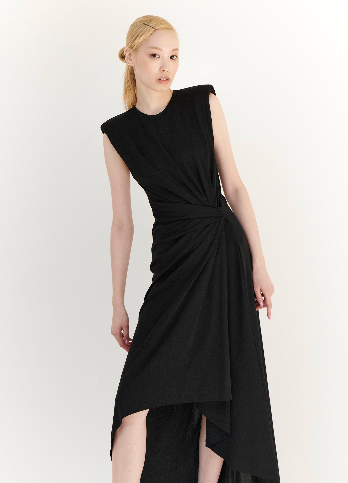 MONSE Gathered Power Shoulder Dress in Black on Model Leaning Front View