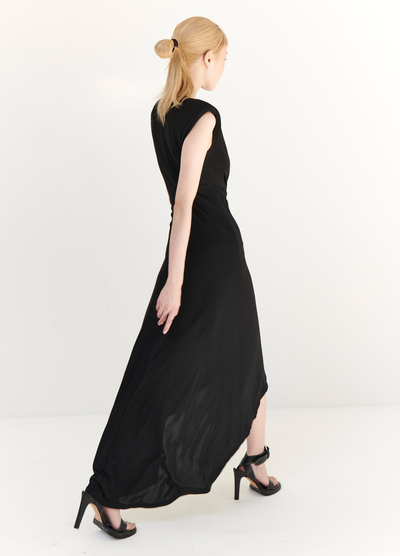 MONSE Gathered Power Shoulder Dress in Black on Model Walking Back View