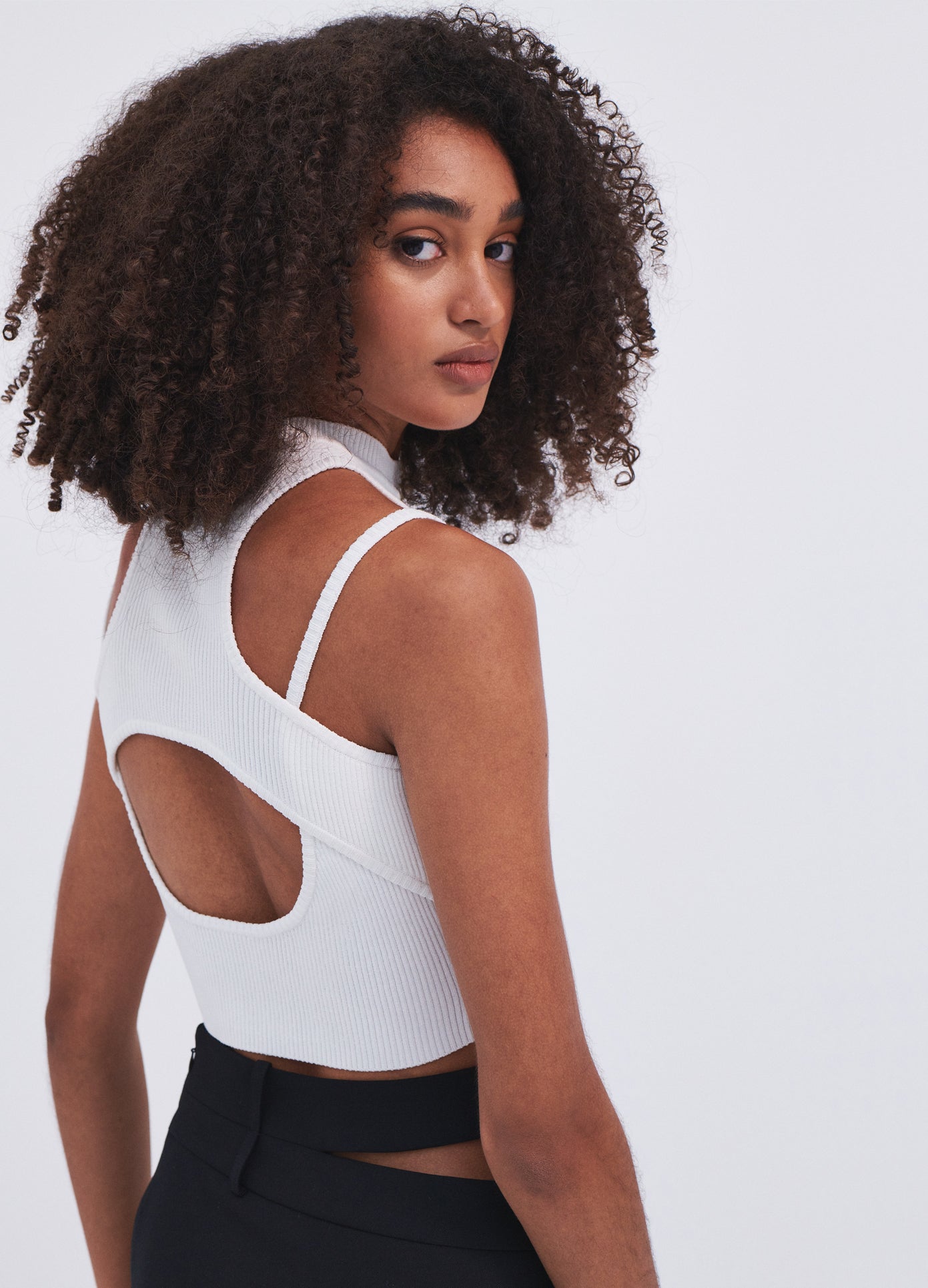 MONSE Halter Neck Knit Cropped Top in Ivory on model back view