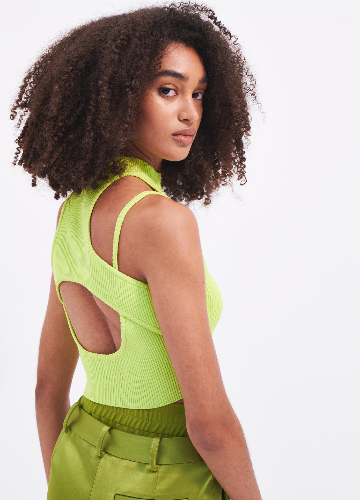 MONSE Halter Neck Knit Cropped Top in Neon Green on model side back view