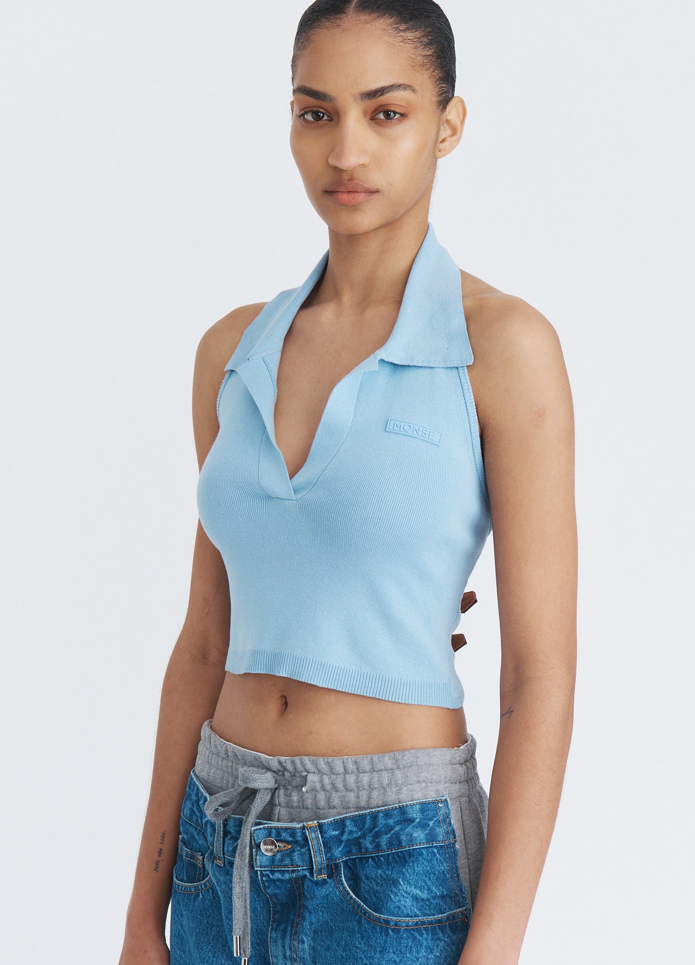 MONSE Halter Neck Knit Top in sky blue on model front view