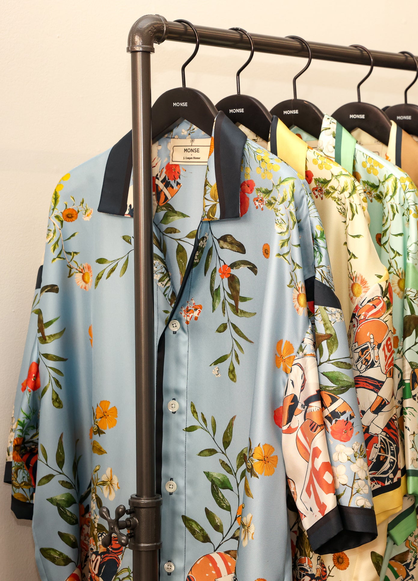 MONSE x J. Logan Home Silk Short Sleeve Shirt in blue multi hanging up