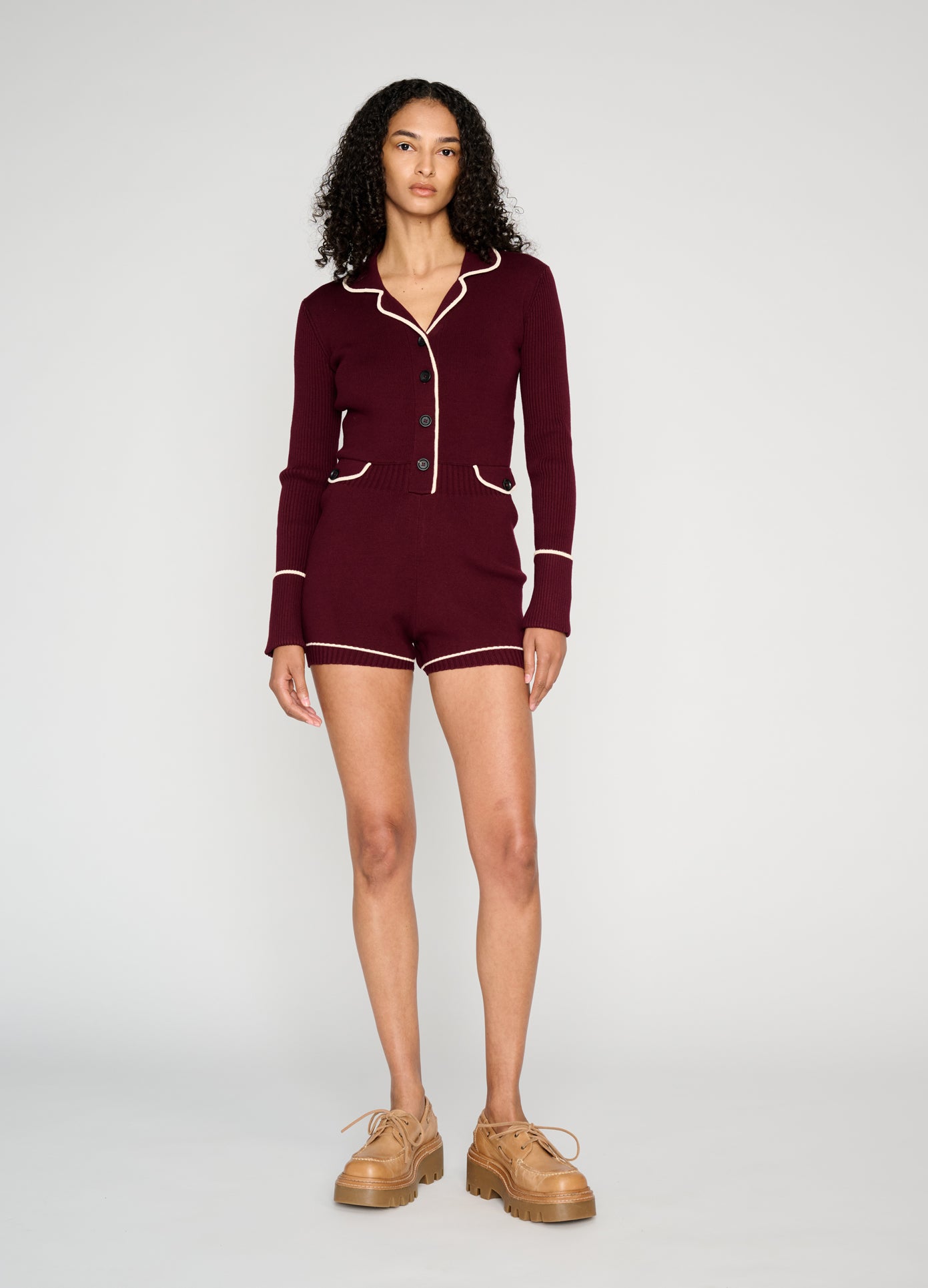 MONSE Knitted Pajama Romper in burgundy on model style full front view