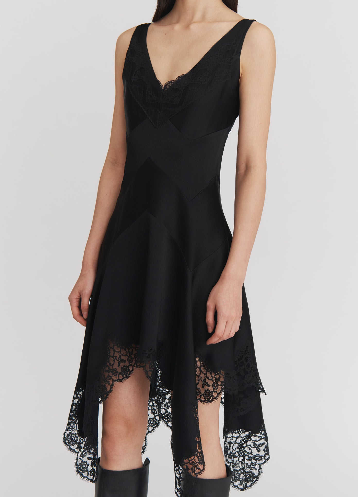 MONSE Lace Triangle Flared Mini Dress in Black on model front detail view