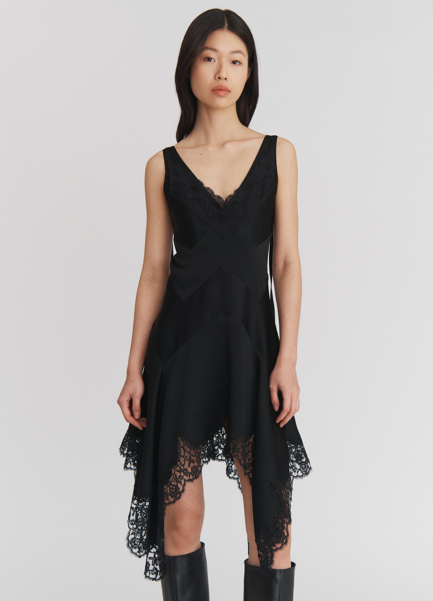 MONSE Lace Triangle Flared Mini Dress in Black on model front view