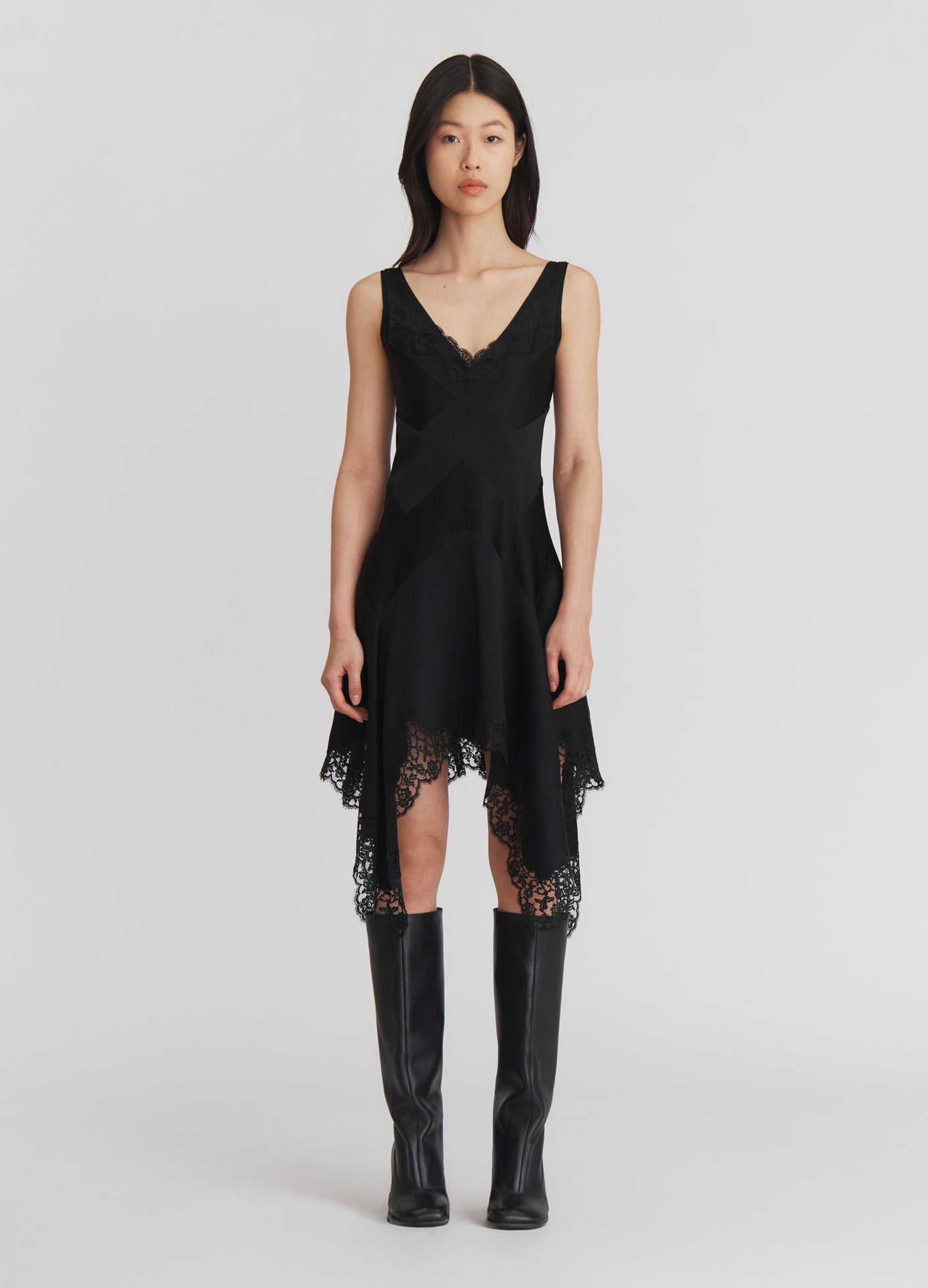 MONSE Lace Triangle Flared Mini Dress in Black on model full front view