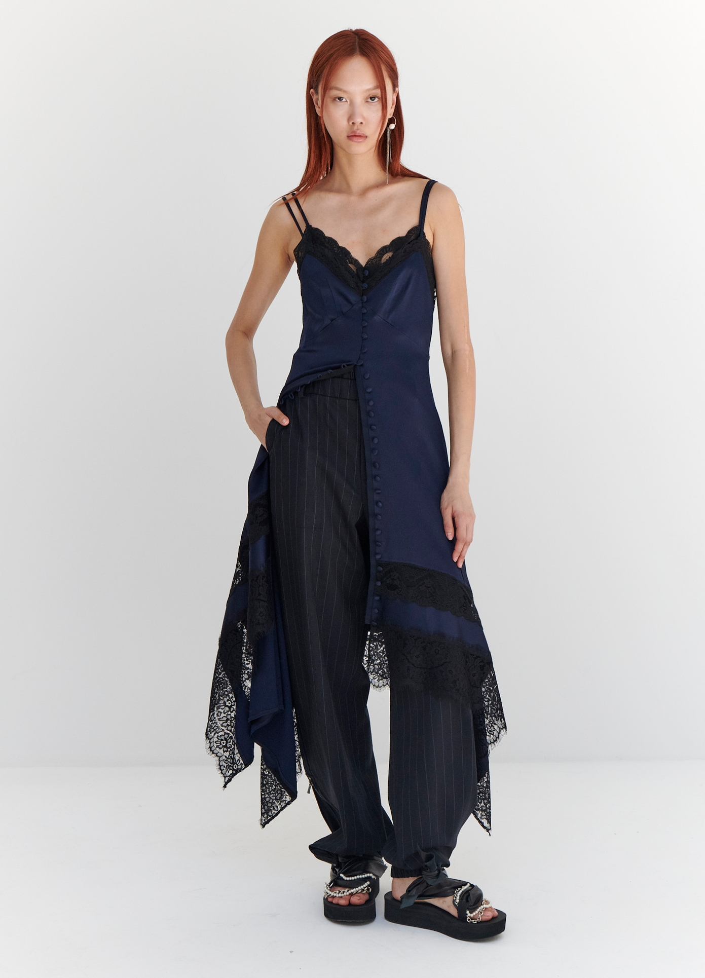MONSE Lace Trim Slip Dress in Midnight on model with hand in pocket full front view