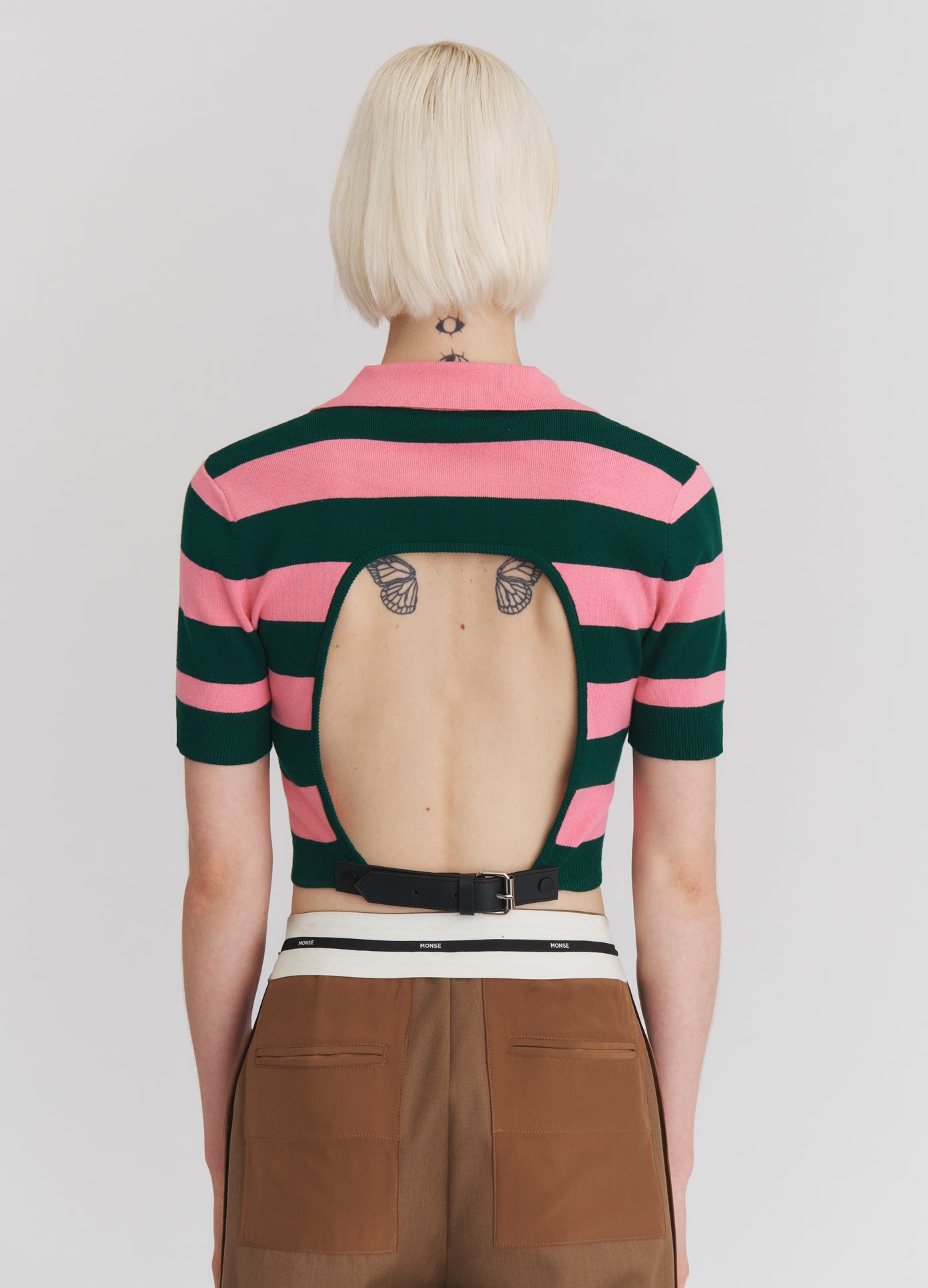 MONSE Leather Belt Back Cut Out Short Sleeve Knitted Top in Green and Pink on model back view