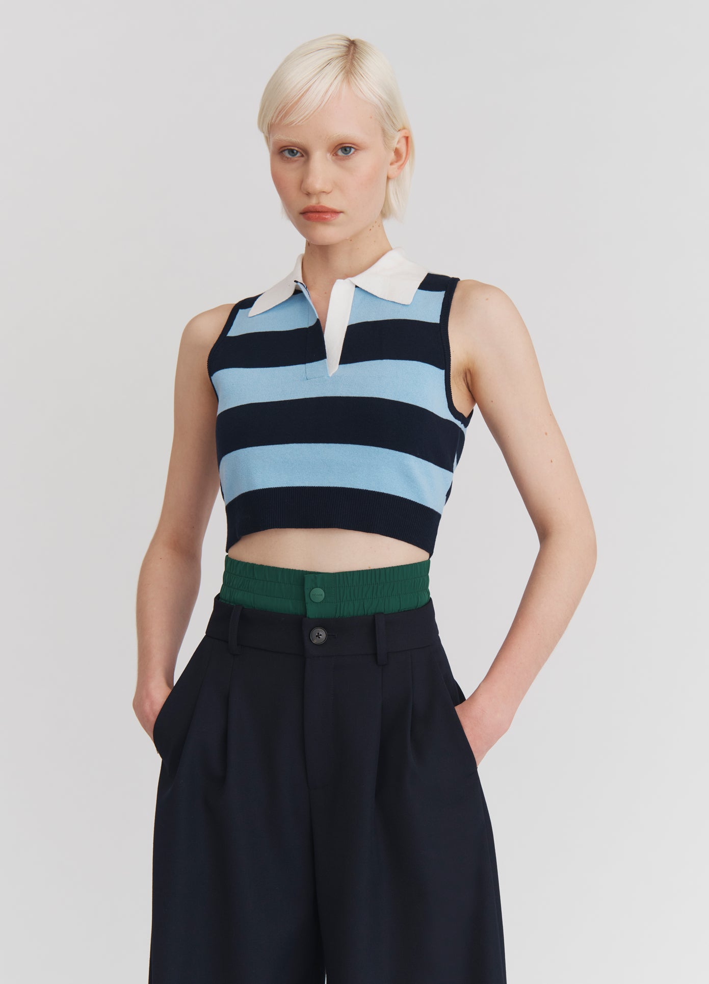 MONSE Leather Belt Back Cut Out Sleeveless Knitted Top in Navy Stripe on model front view