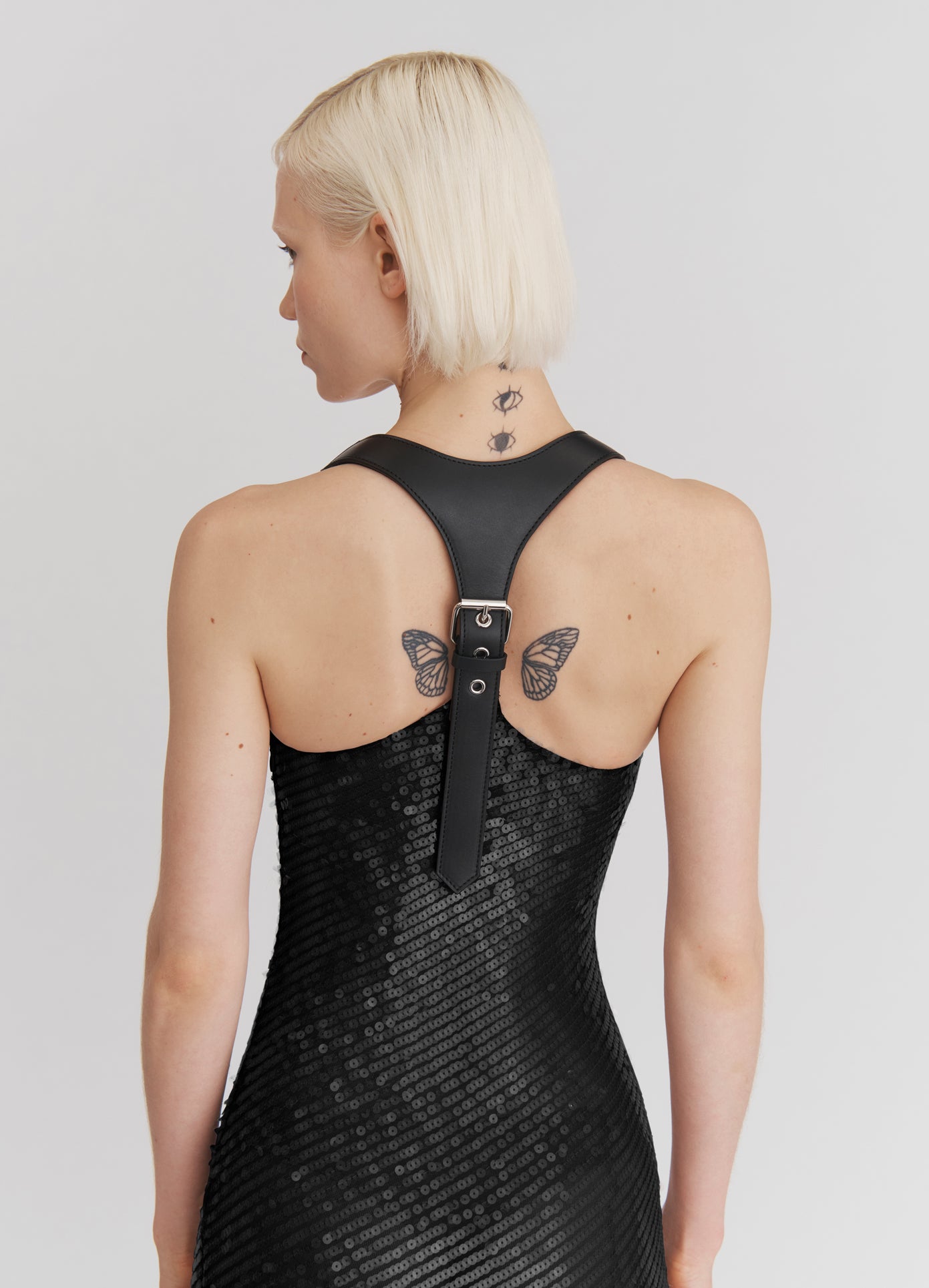 MONSE Leather Harness Sequin Dress in black on model back view