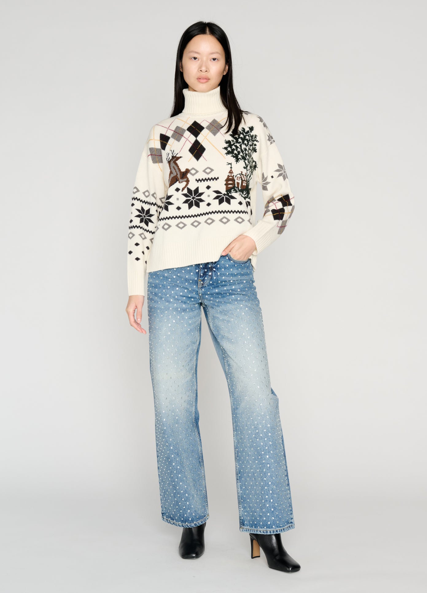 MONSE Mixed Fair Isle Roll Neck Sweater in white on model with hand in pocket full front view