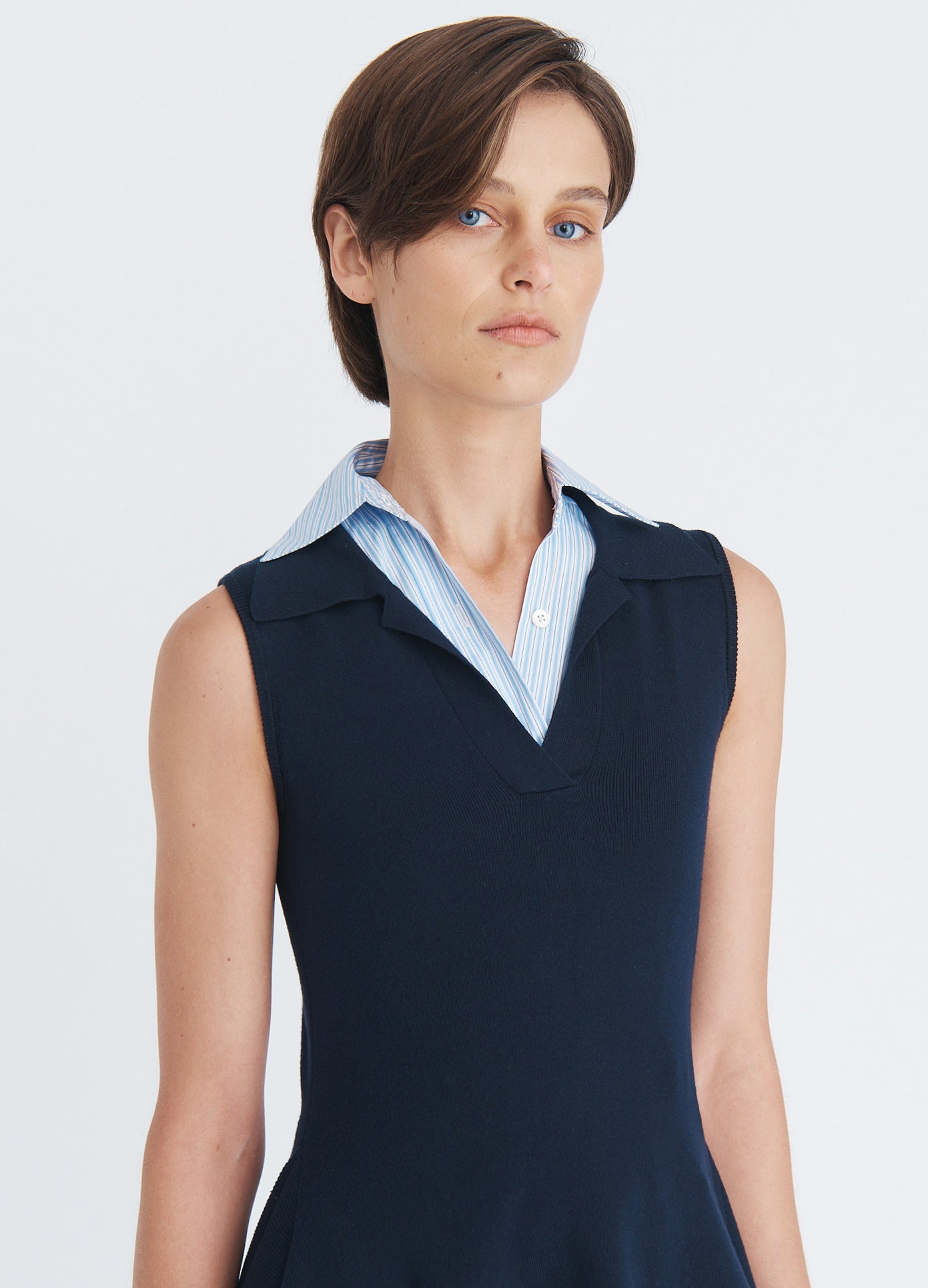 MONSE Napkin Hem Backless Knit Top in navy on model front view