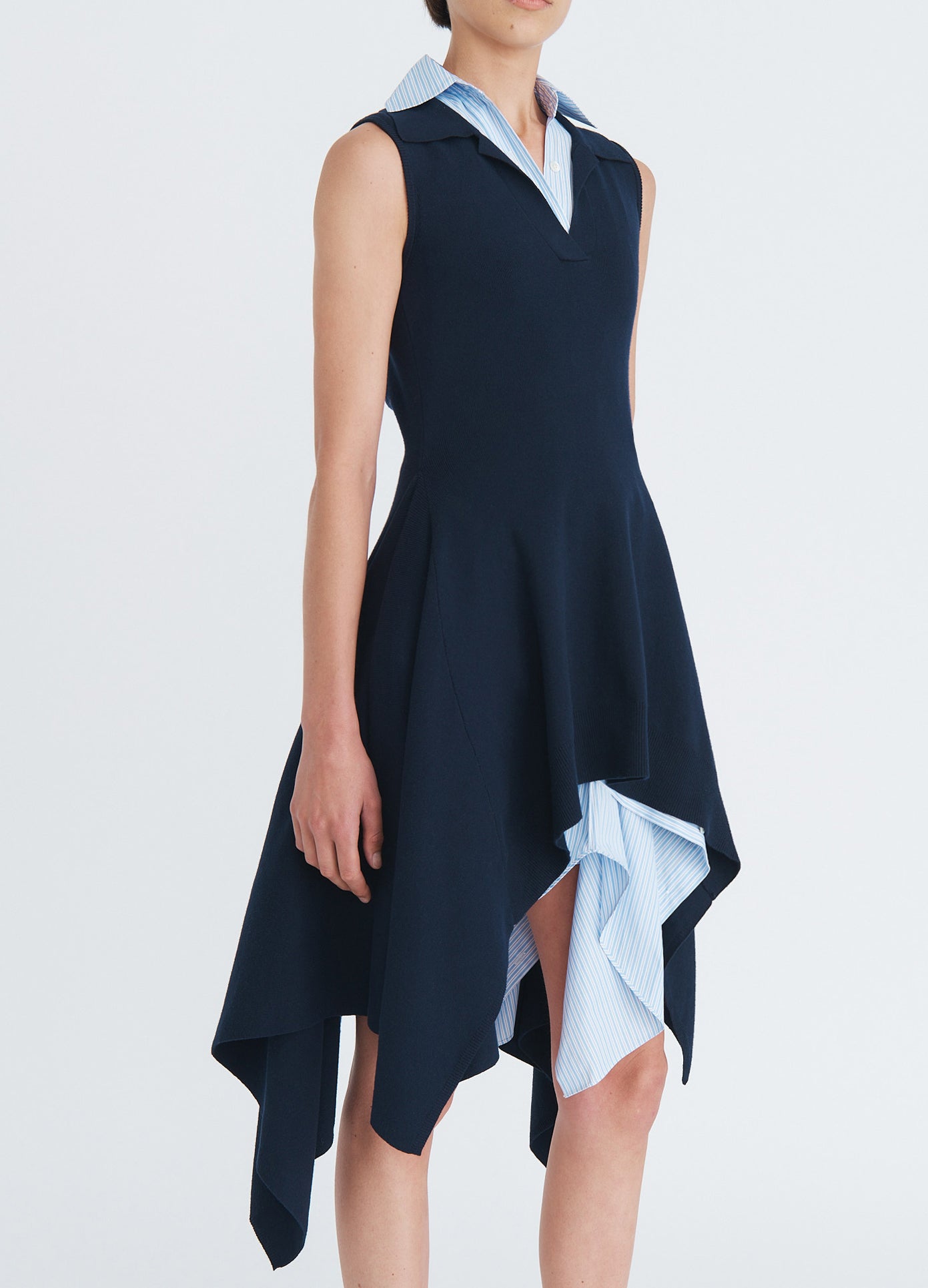 MONSE Napkin Hem Backless Knit Top in navy on model side view