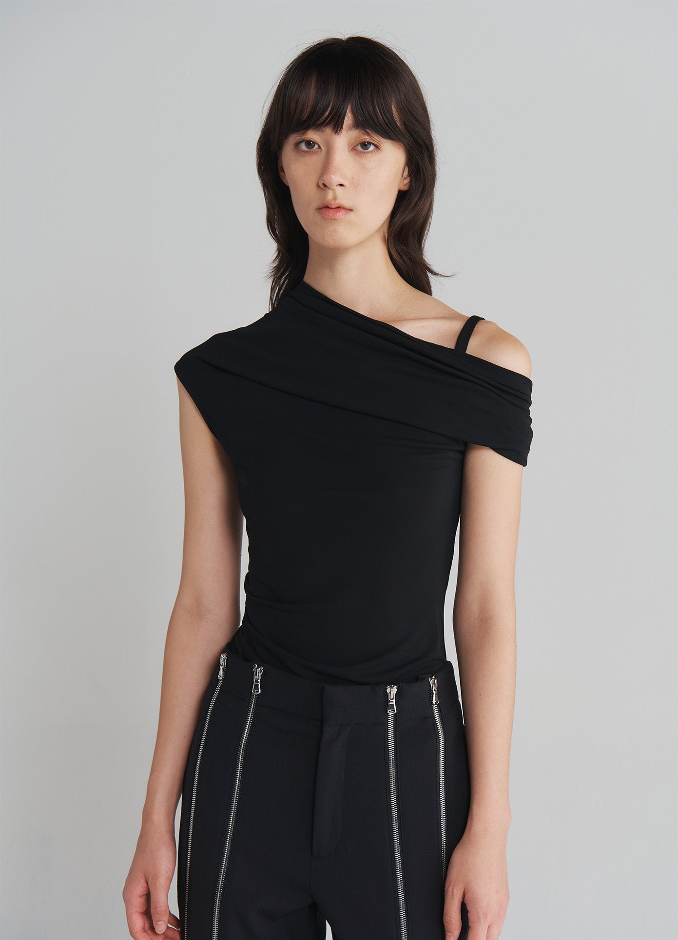 MONSE Off Shoulder Jersey Top in Black on model front view