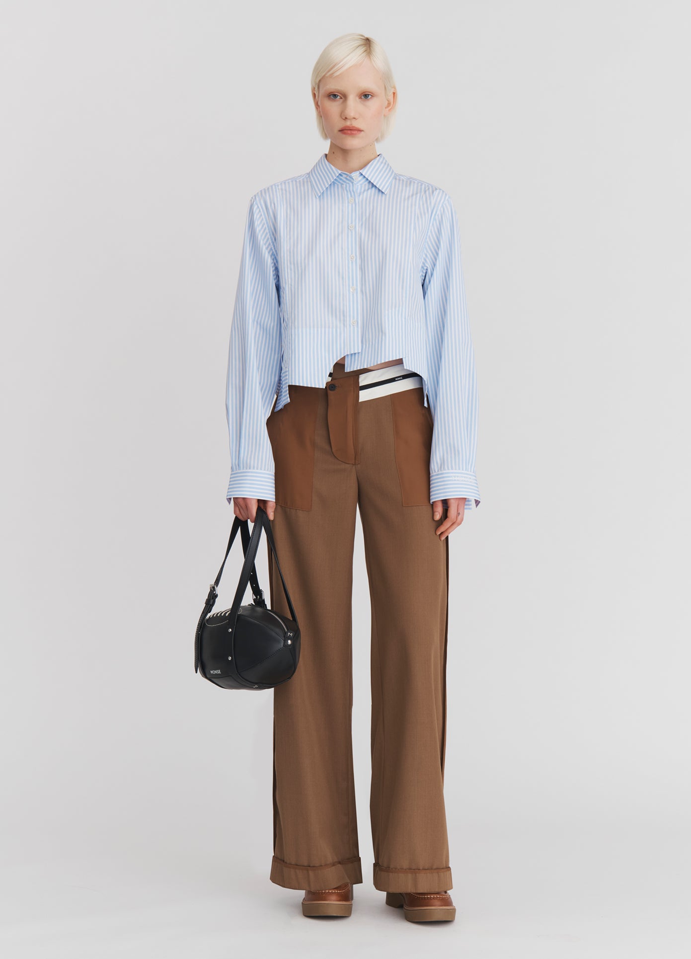 MONSE Paneled Cropped Shirt in Light Blue Stripe on model full front view