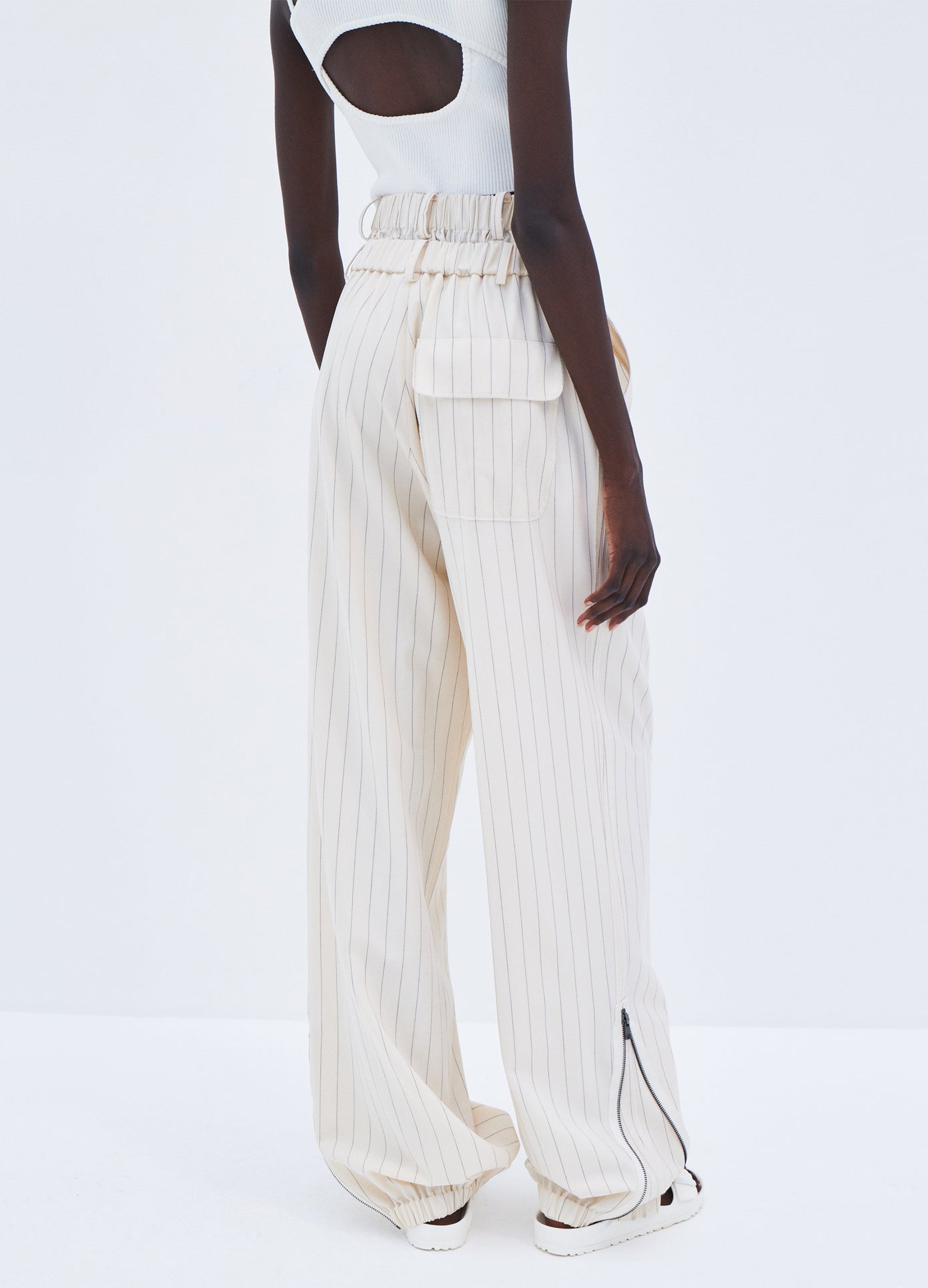 MONSE Pinstripe Double Waistband Zip Detail Pant in Ivory Pinstripe on model back detail view