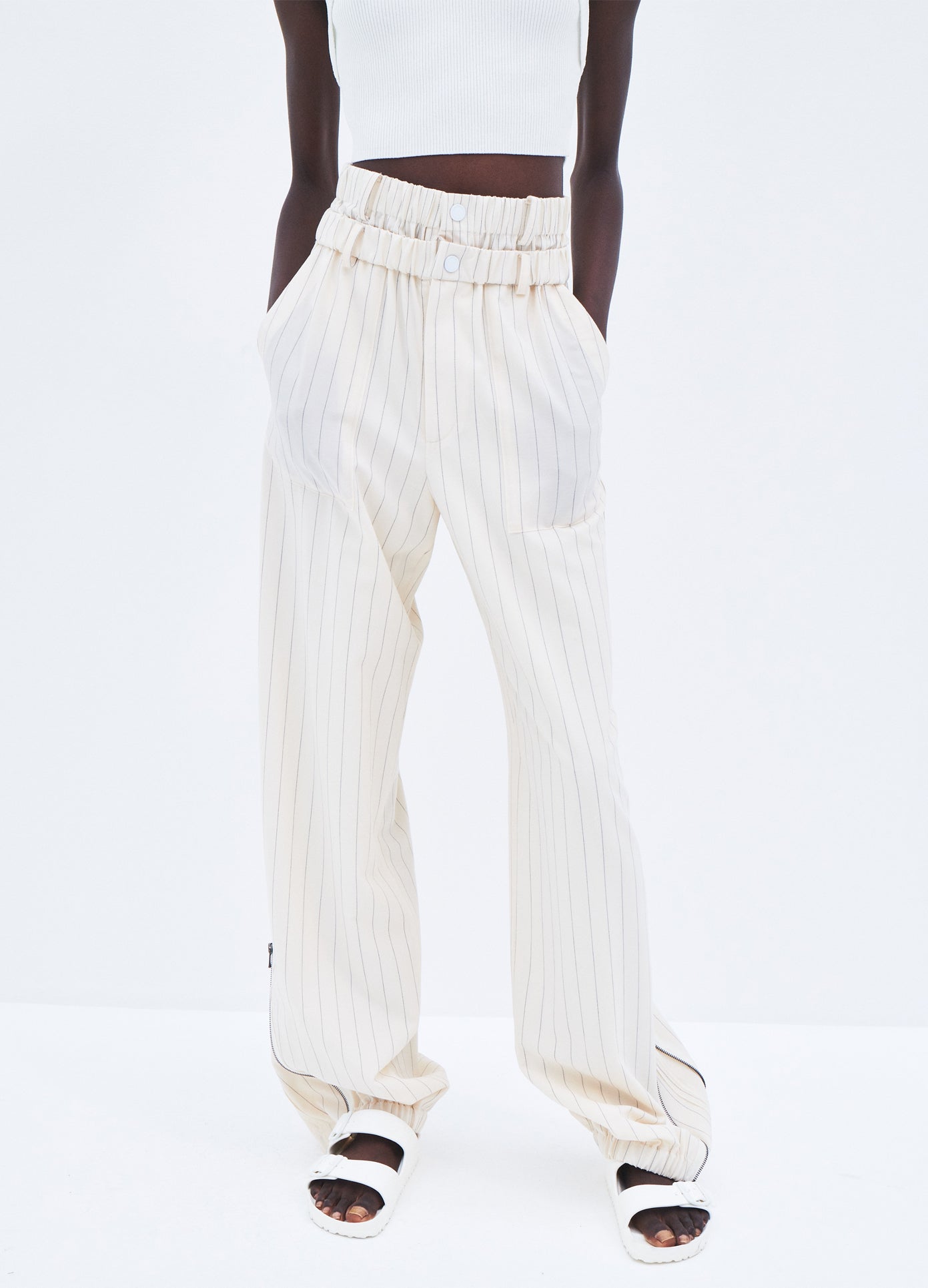 MONSE Pinstripe Double Waistband Zip Detail Pant in Ivory Pinstripe on model front detail view