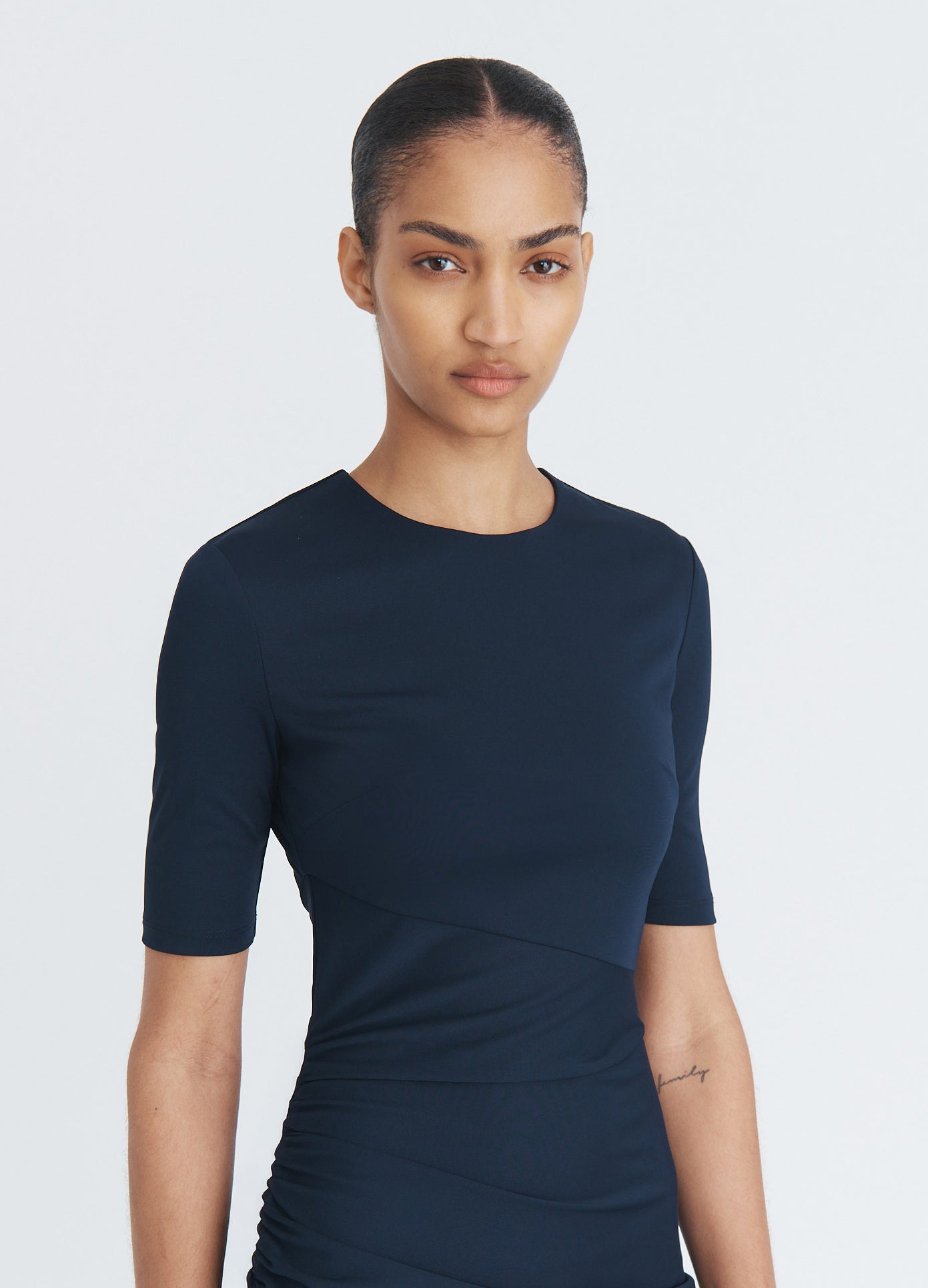 MONSE Ruched Fitted T-Shirt Dress in midnight on model front detail view