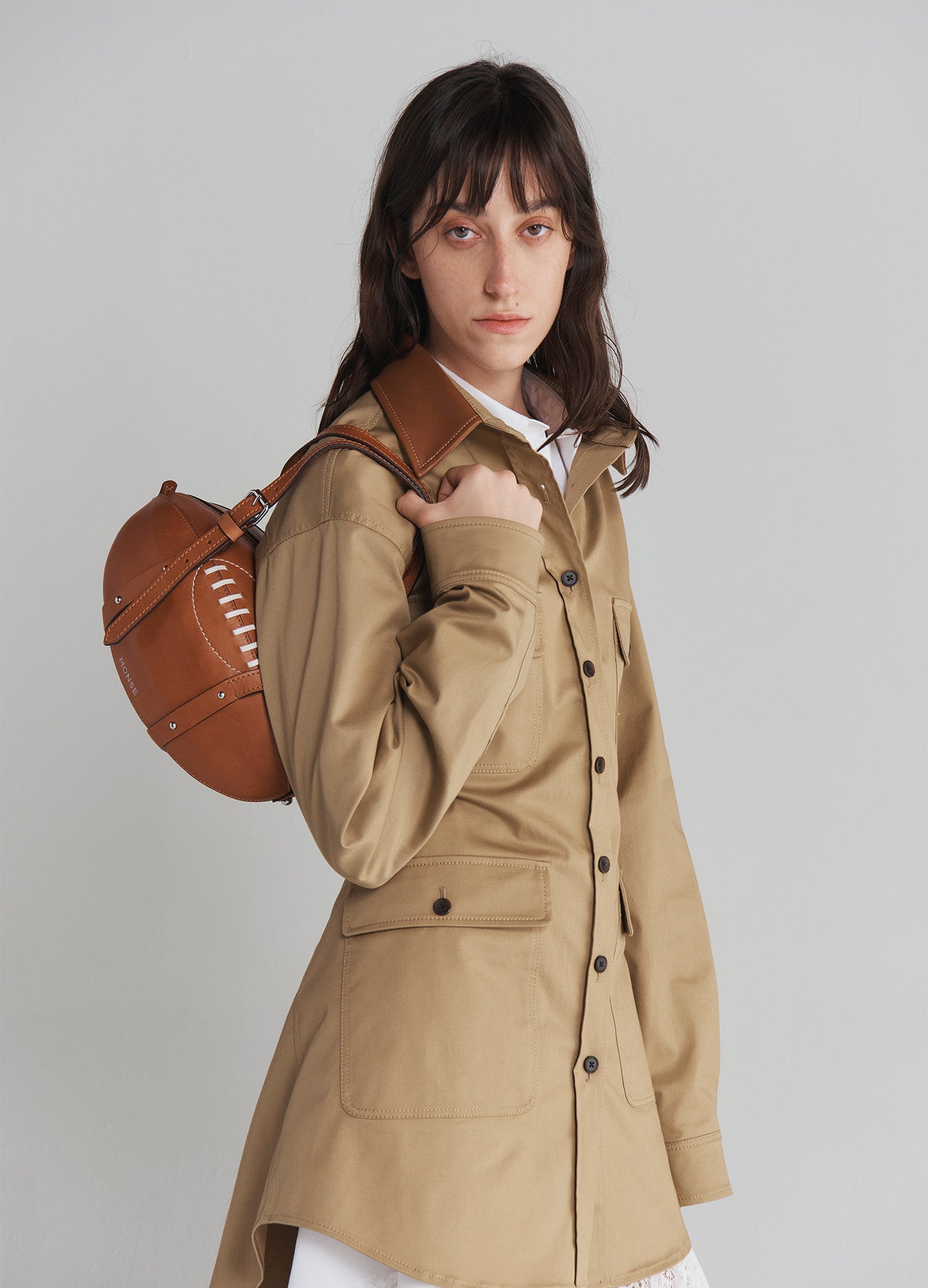 MONSE Rugby Bag in Brown Leather on model's shoulder side view