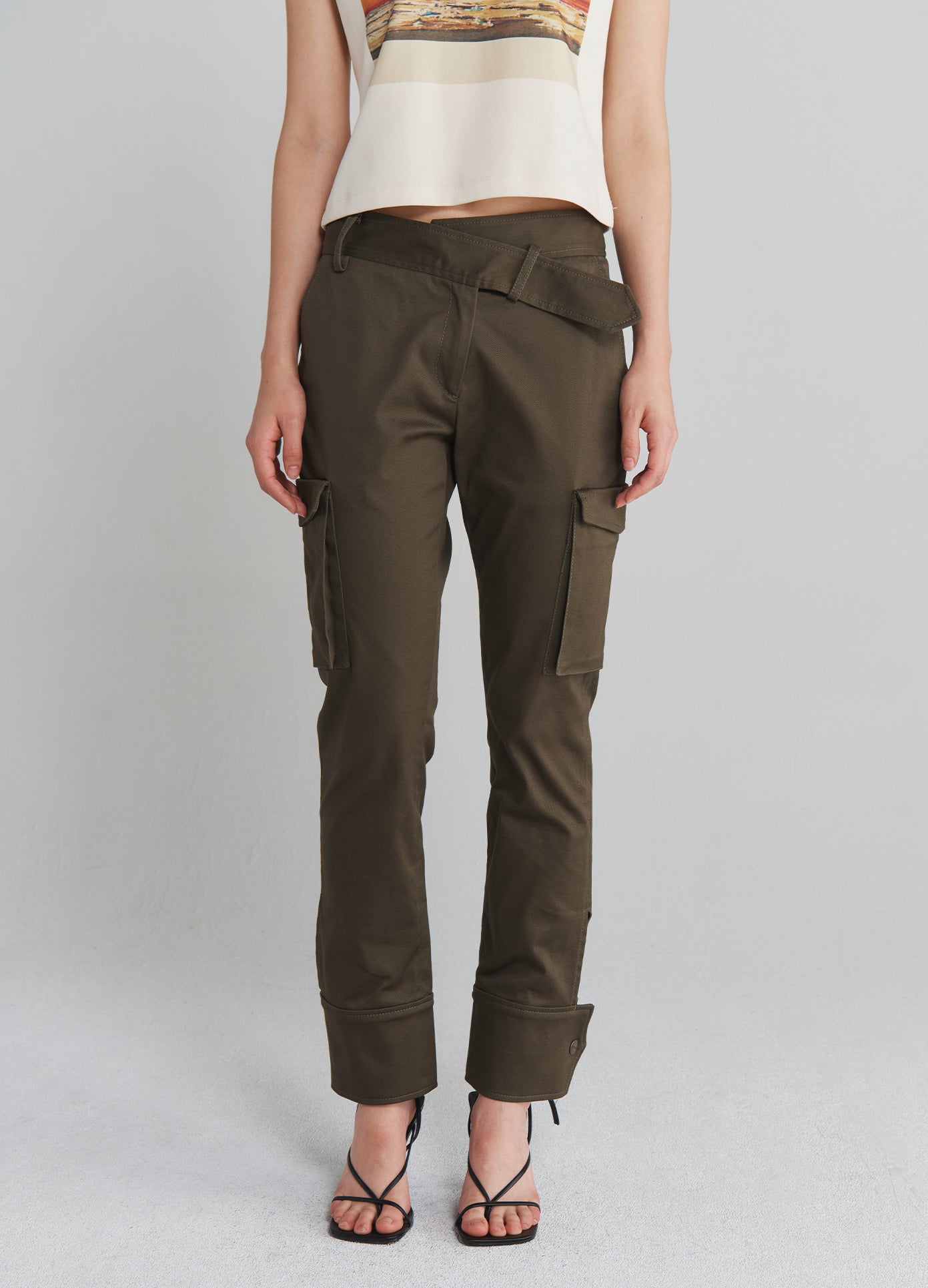 MONSE Slanted Waistband Cargo Pants in Olive on model front bottom view