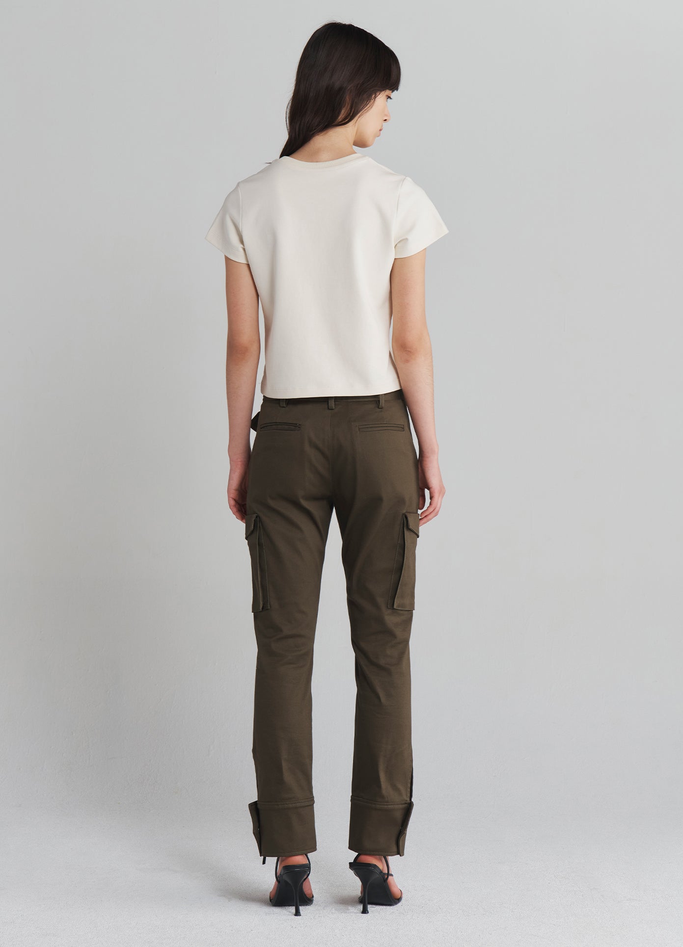 MONSE Slanted Waistband Cargo Pants in Olive on model full back view