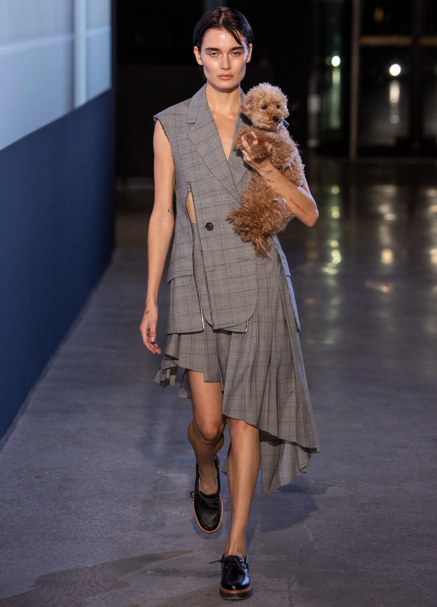 MONSE Slashed Zipper Tailored Vest in grey on model walking runway