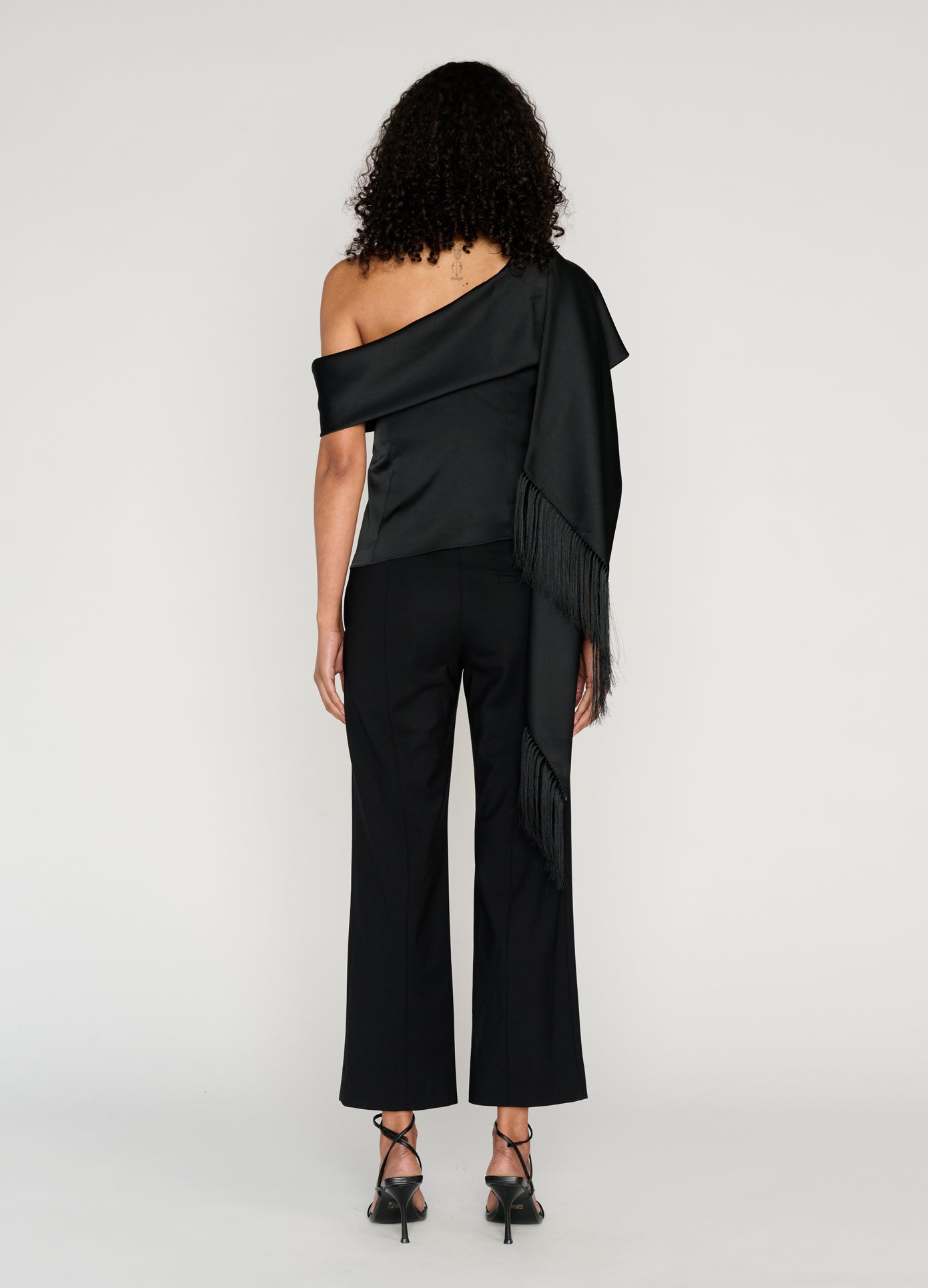 MONSE Sleeveless Asymmetric Hem Scarf Top in black on model full back view
