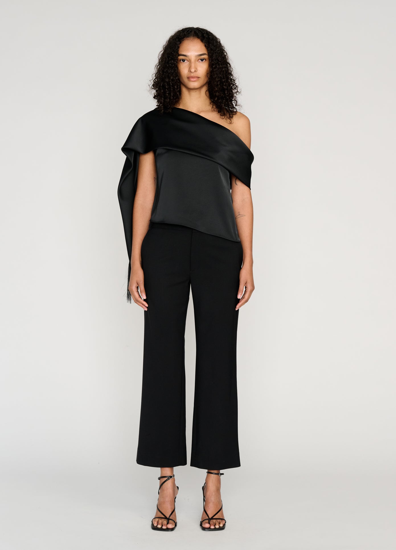 MONSE Sleeveless Asymmetric Hem Scarf Top in black on model full front view