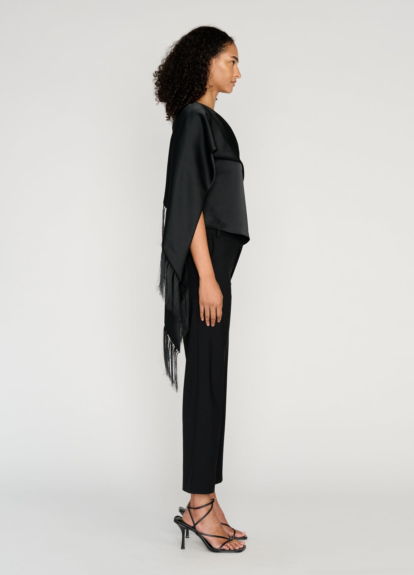 MONSE Sleeveless Asymmetric Hem Scarf Top in black on model full side view