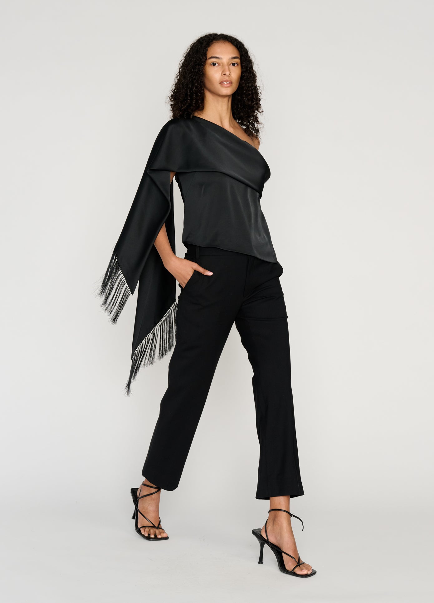 MONSE Sleeveless Asymmetric Hem Scarf Top in black on model walking full front view