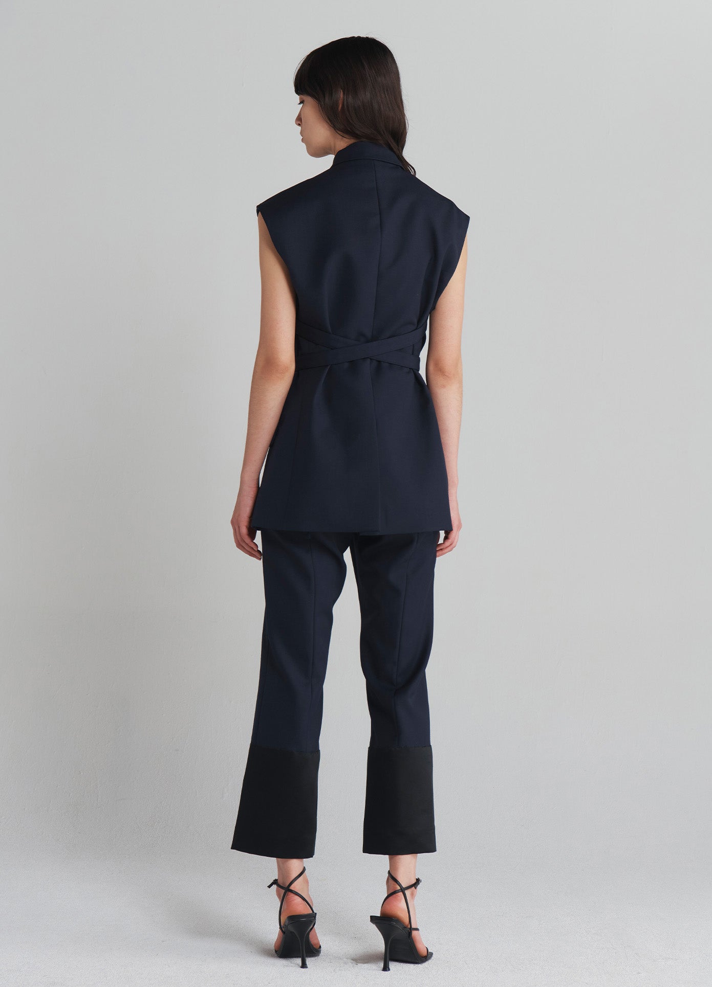 MONSE Sleeveless Criss Cross Front Jacket in Midnight on model full back view