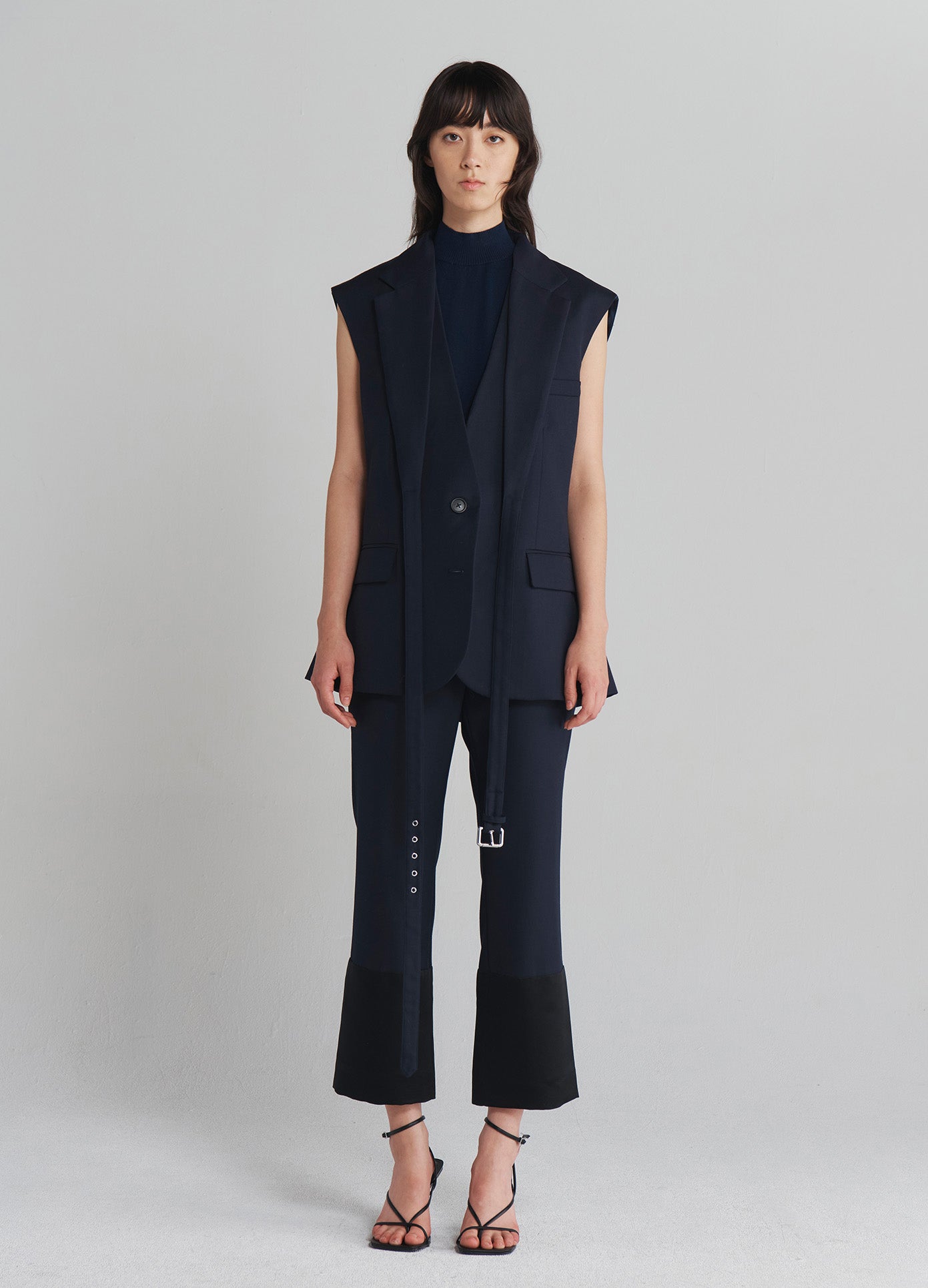 MONSE Sleeveless Criss Cross Front Jacket in Midnight on model full front view