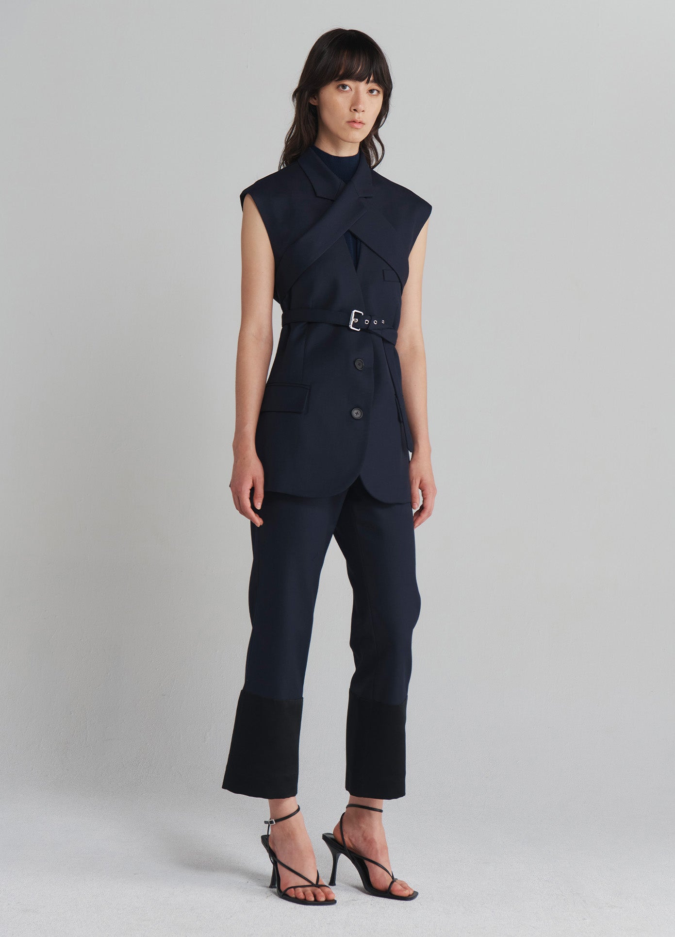 MONSE Sleeveless Criss Cross Front Jacket in Midnight on model full side view