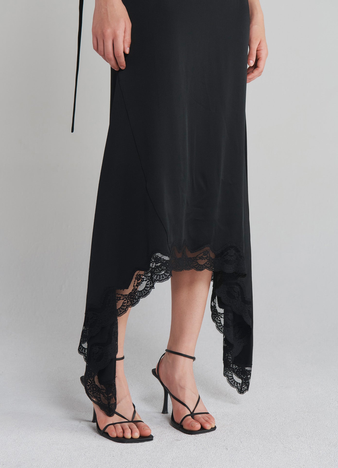 MONSE Slip Dress With Lace Hem in Black on model front bottom view