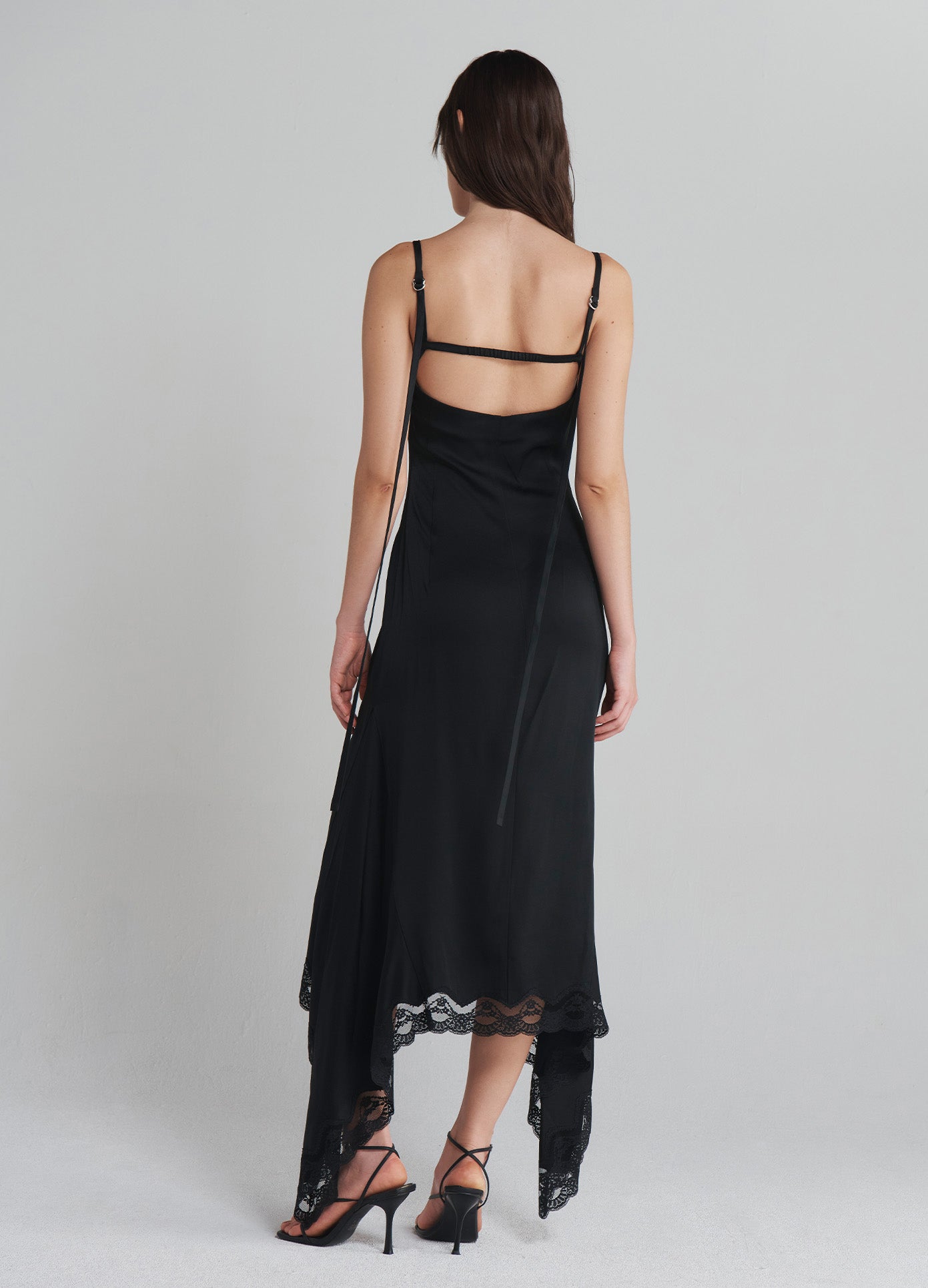 MONSE Slip Dress With Lace Hem in Black on model full back view