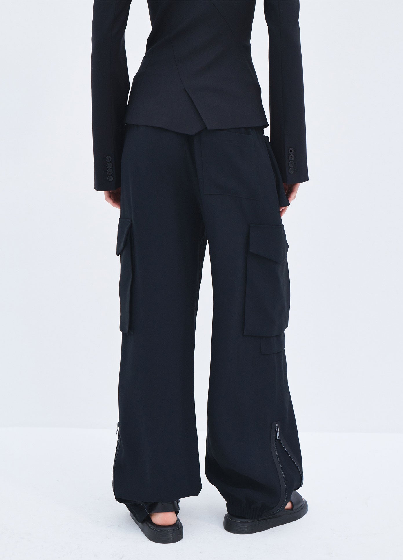 MONSE Spring 2024 Double Waistband Cargo Pants in Black on model back bottoms view